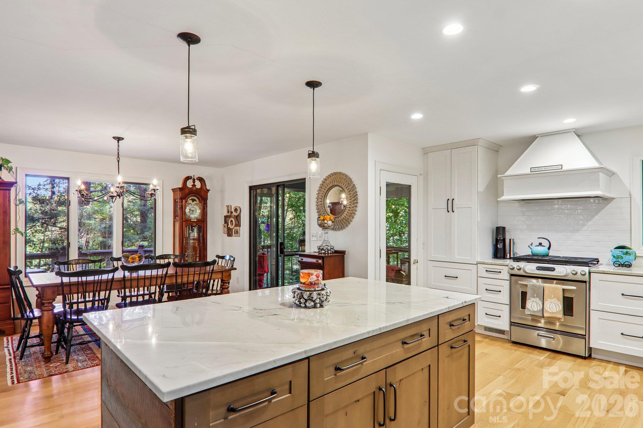 Quartz counter tops, pendant lights for accent over the bar. - 212 Pheasant Run, Hendersonville