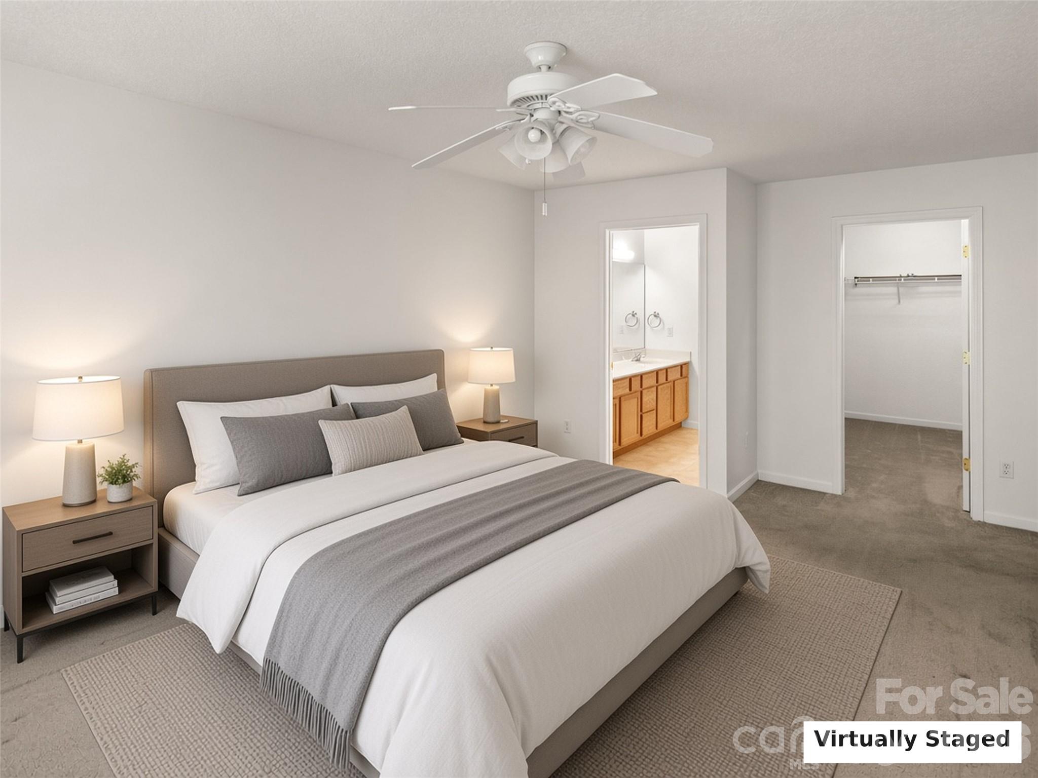 Virtually Staged. Primary bedroom with en-suite bath and closet. - 206 Waters Edge Drive, Weaverville