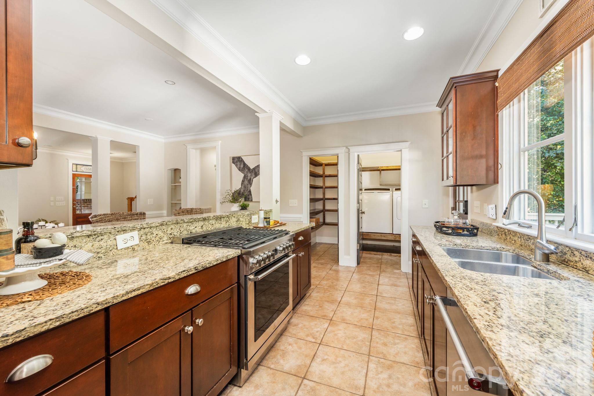 Kitchen with stainless steel appliances and a walk in pantry - 3315 Holt Street, Charlotte