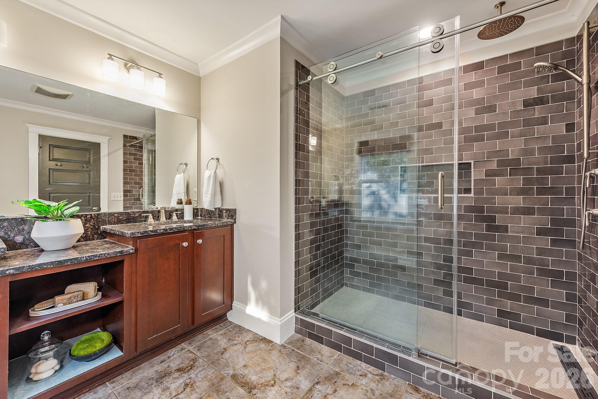 Upper level primary bathroom with walk in shower - 3315 Holt Street, Charlotte