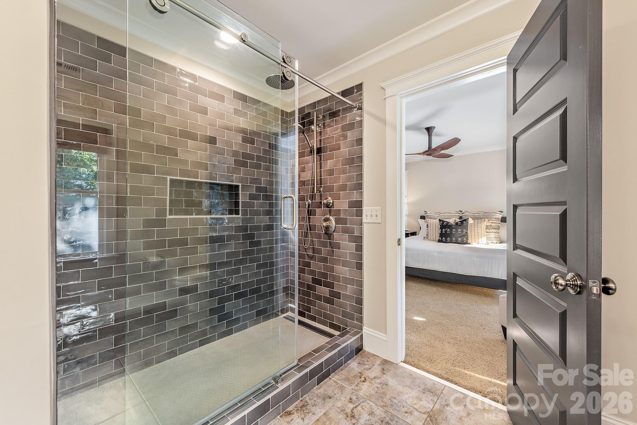 Upper level primary bathroom with walk in shower - 3315 Holt Street, Charlotte