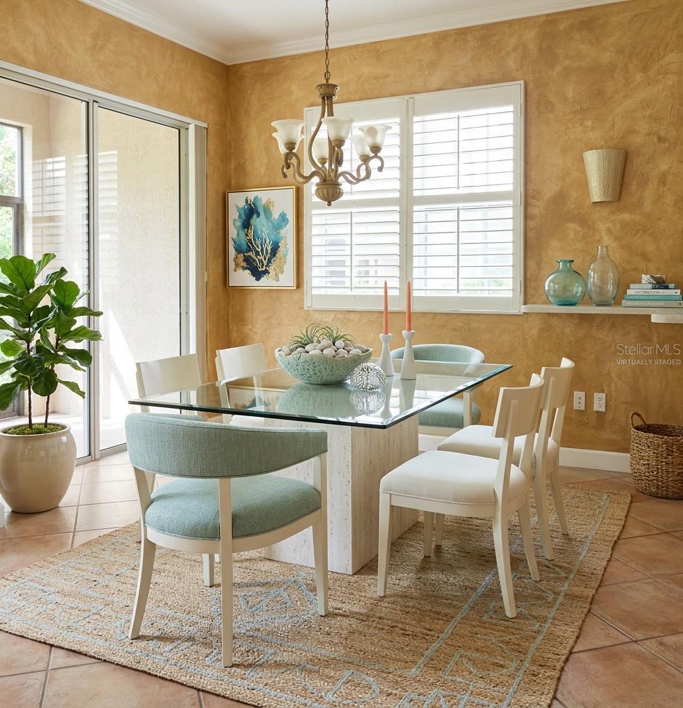 Virtually staged dining room - 7492 BOTANICA PKWY #102, SARASOTA