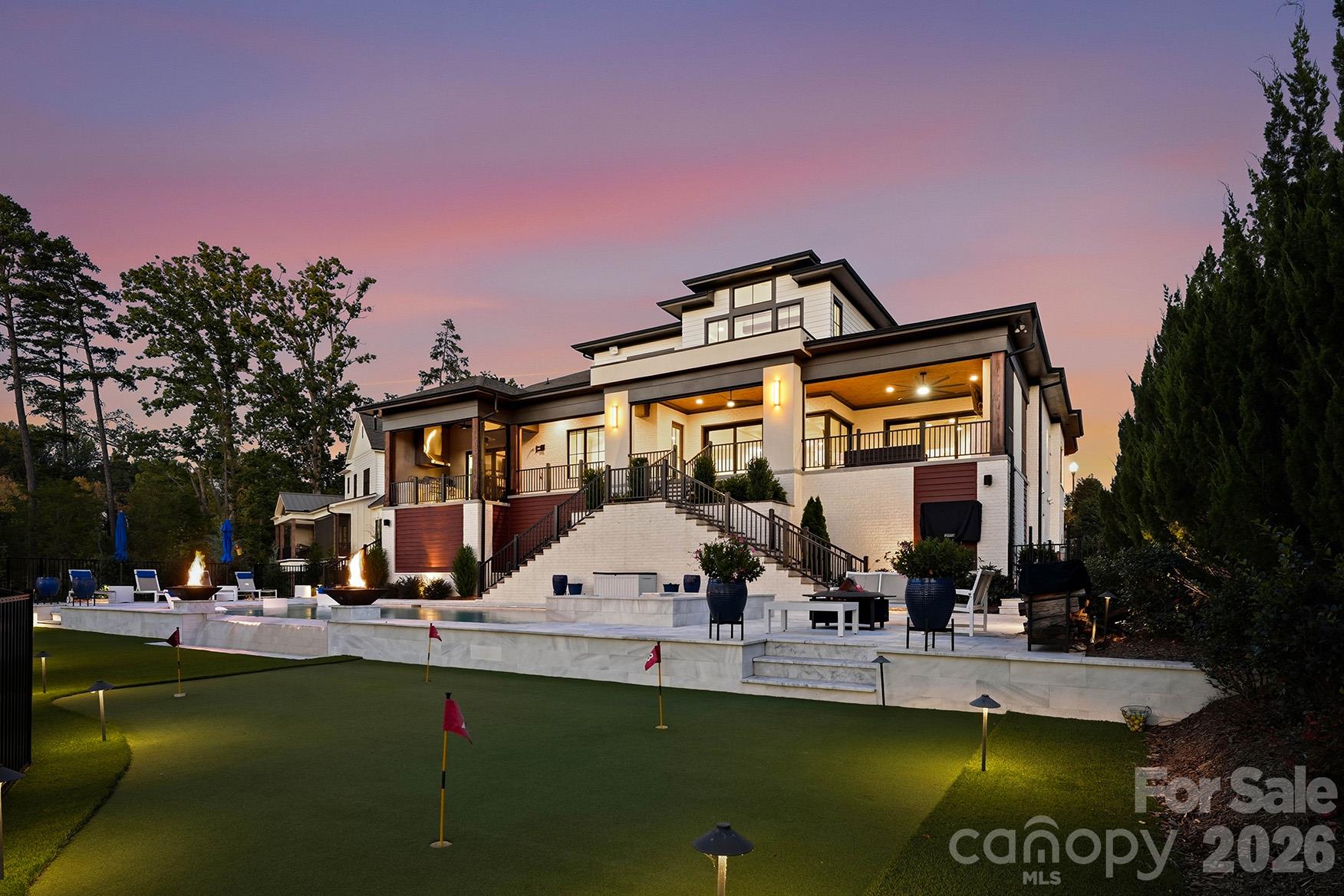 Rear exterior featuring putting green area - 1016 Timberlake Point, Belmont