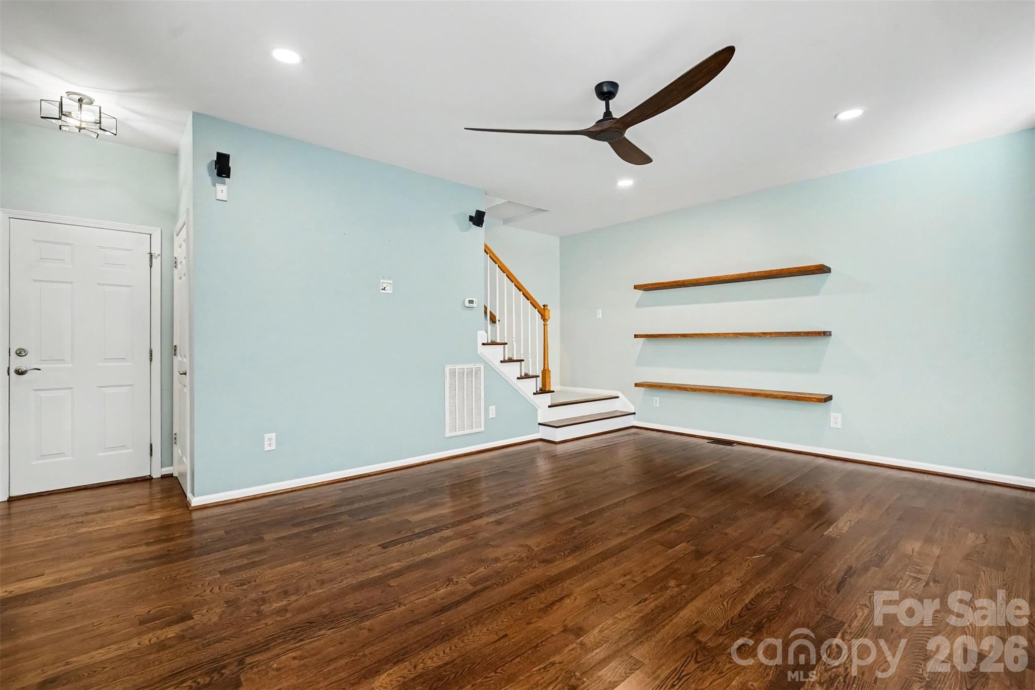 Hardwood floors, open space, floating shelves, ceiling fan - 4104 Bamborough Drive, Fort Mill