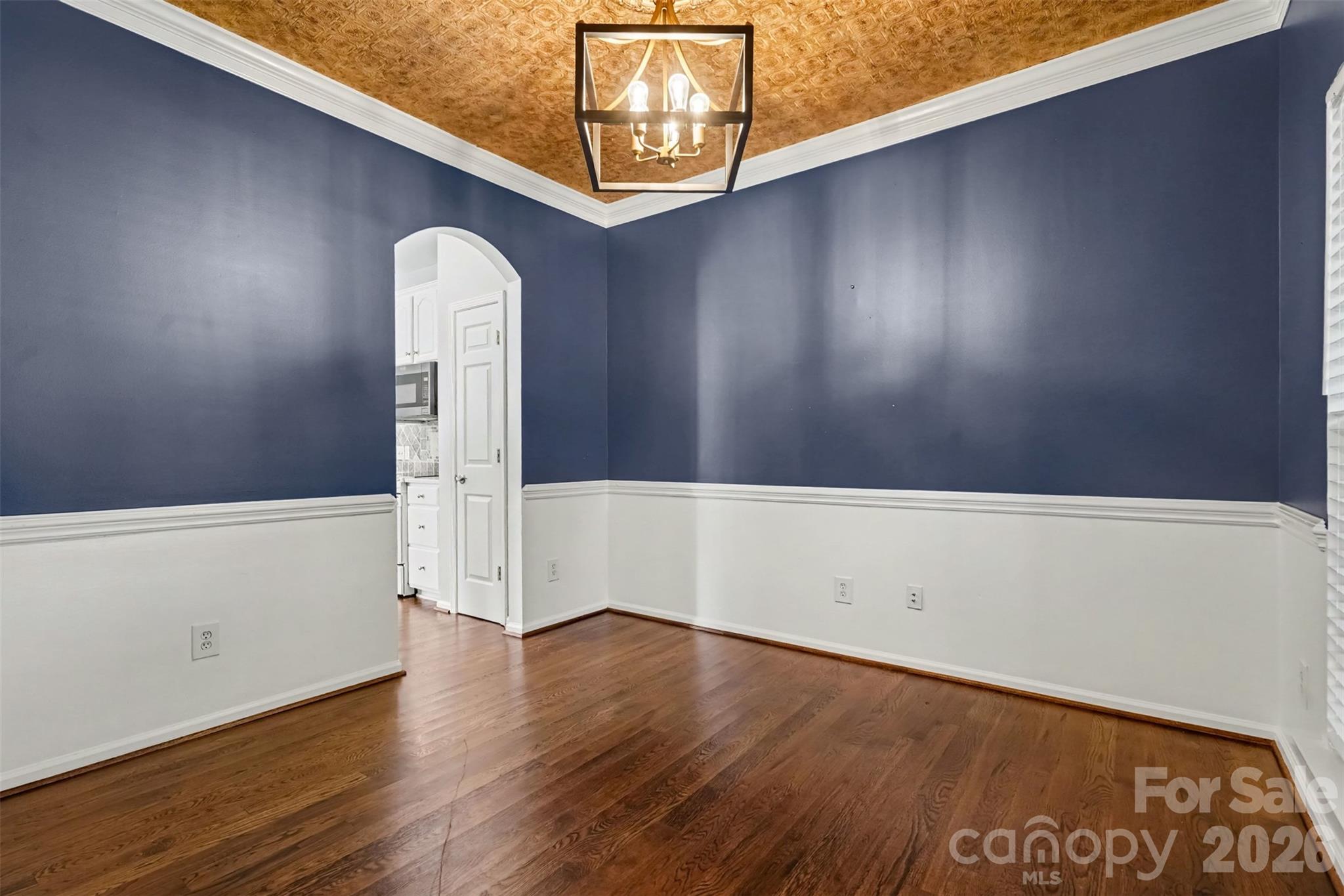 Arched doorways, chair-rail, updated lighting - 4104 Bamborough Drive, Fort Mill