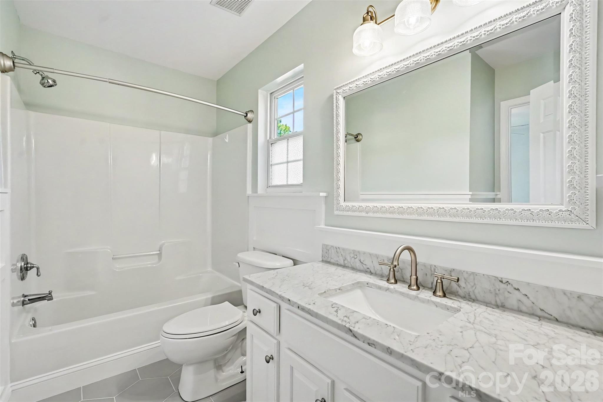 Jack and Jill bath with updates! Nice trim work, counter tops. - 4104 Bamborough Drive, Fort Mill