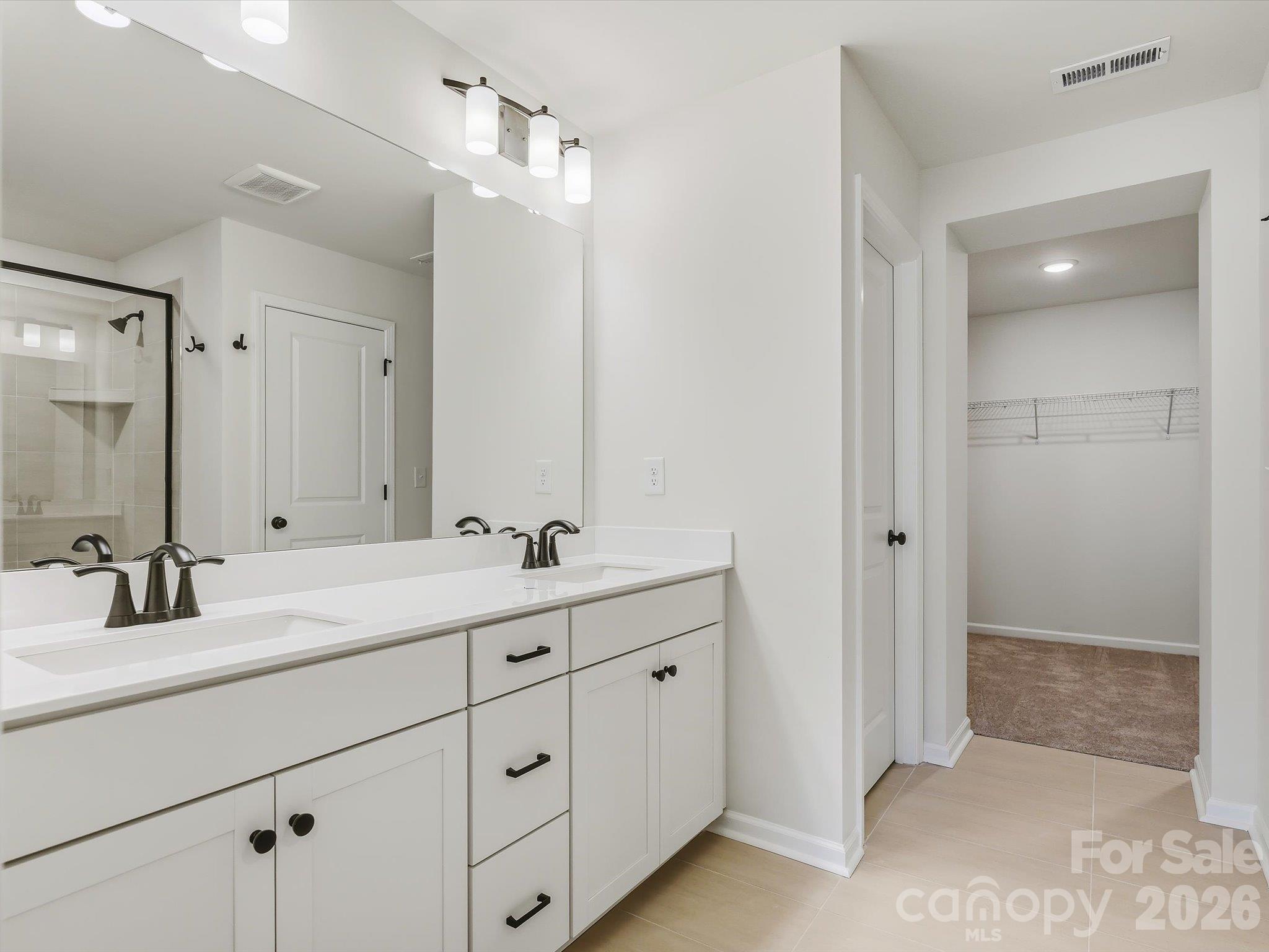 Primary bathroom and closet - 13113 Benessare Lane, Matthews