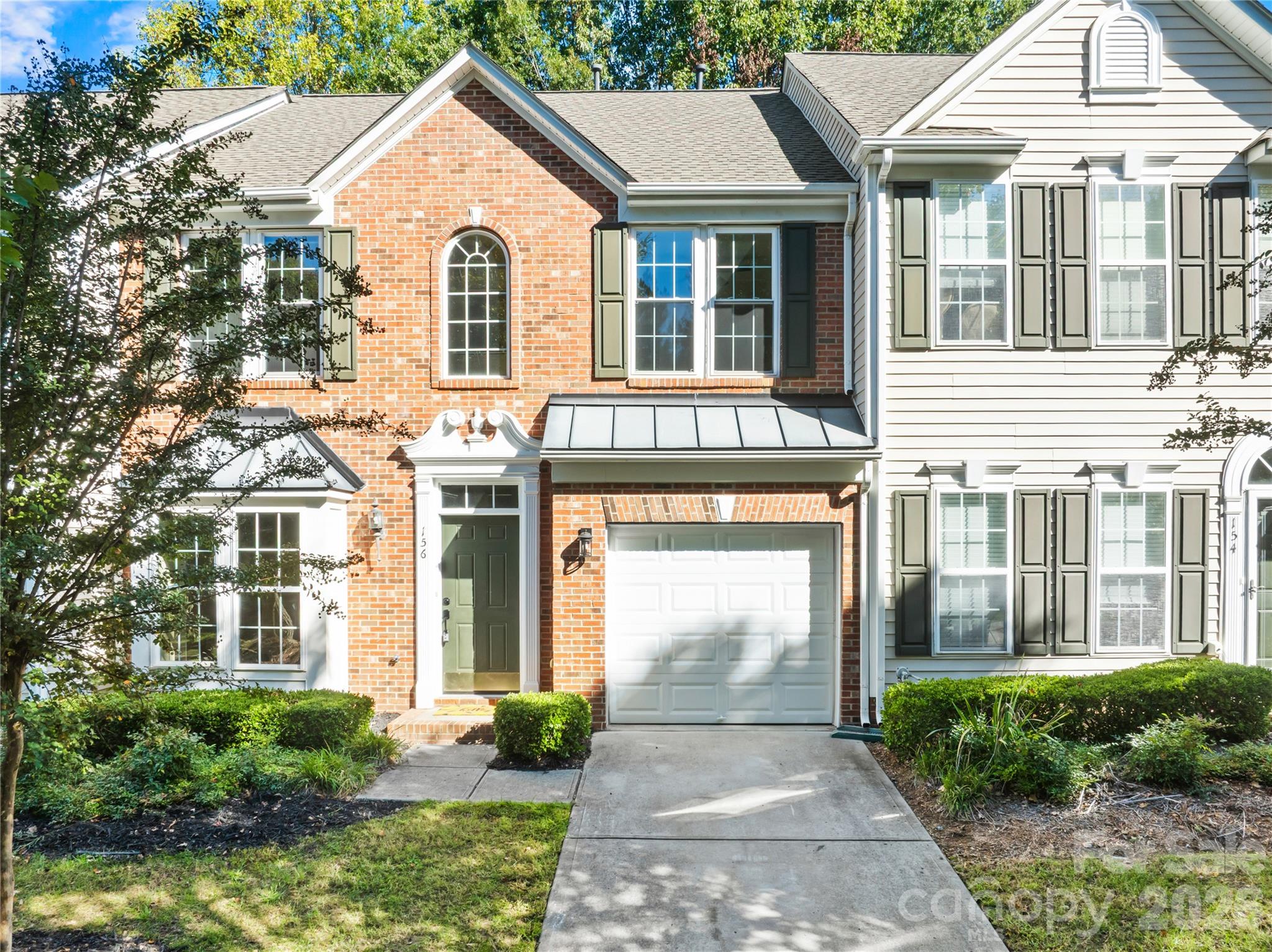 Brick front with a one-car garage - 156 N Arcadian Way, Mooresville