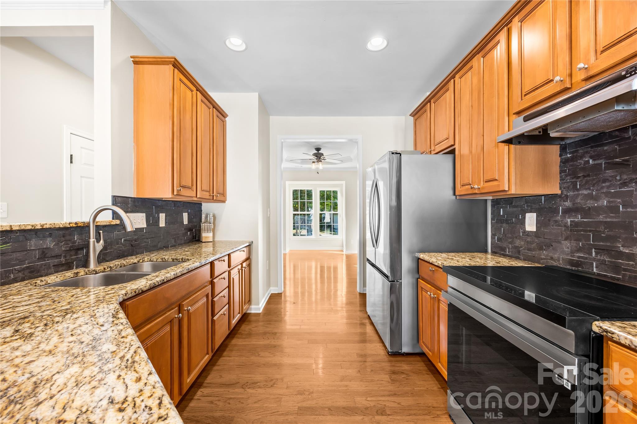 The nearly new electric range has an induction cooktop! - 156 N Arcadian Way, Mooresville