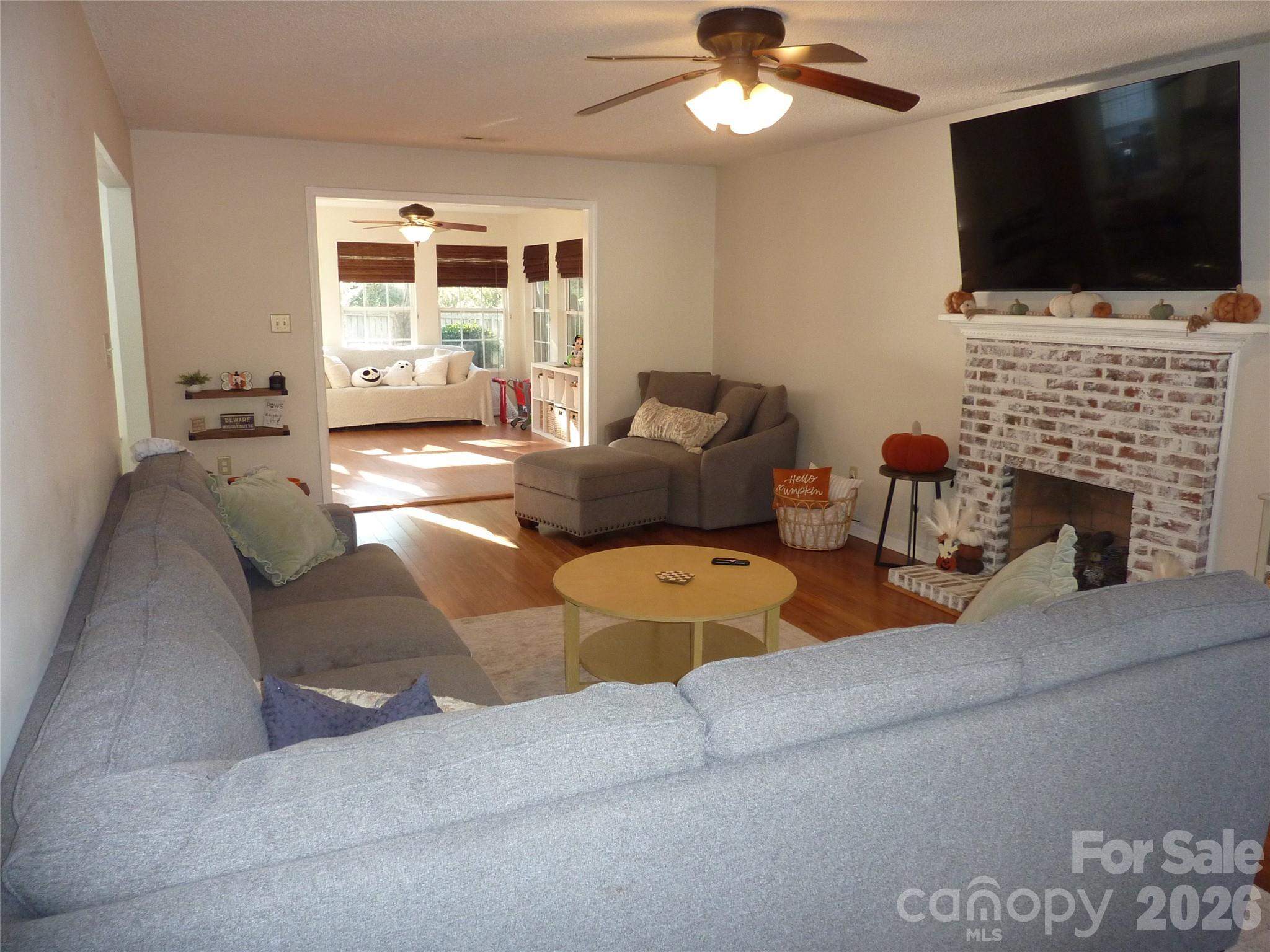 Great Room w/fireplace open to sunroom - 3716 NW Winterberry Court, Concord