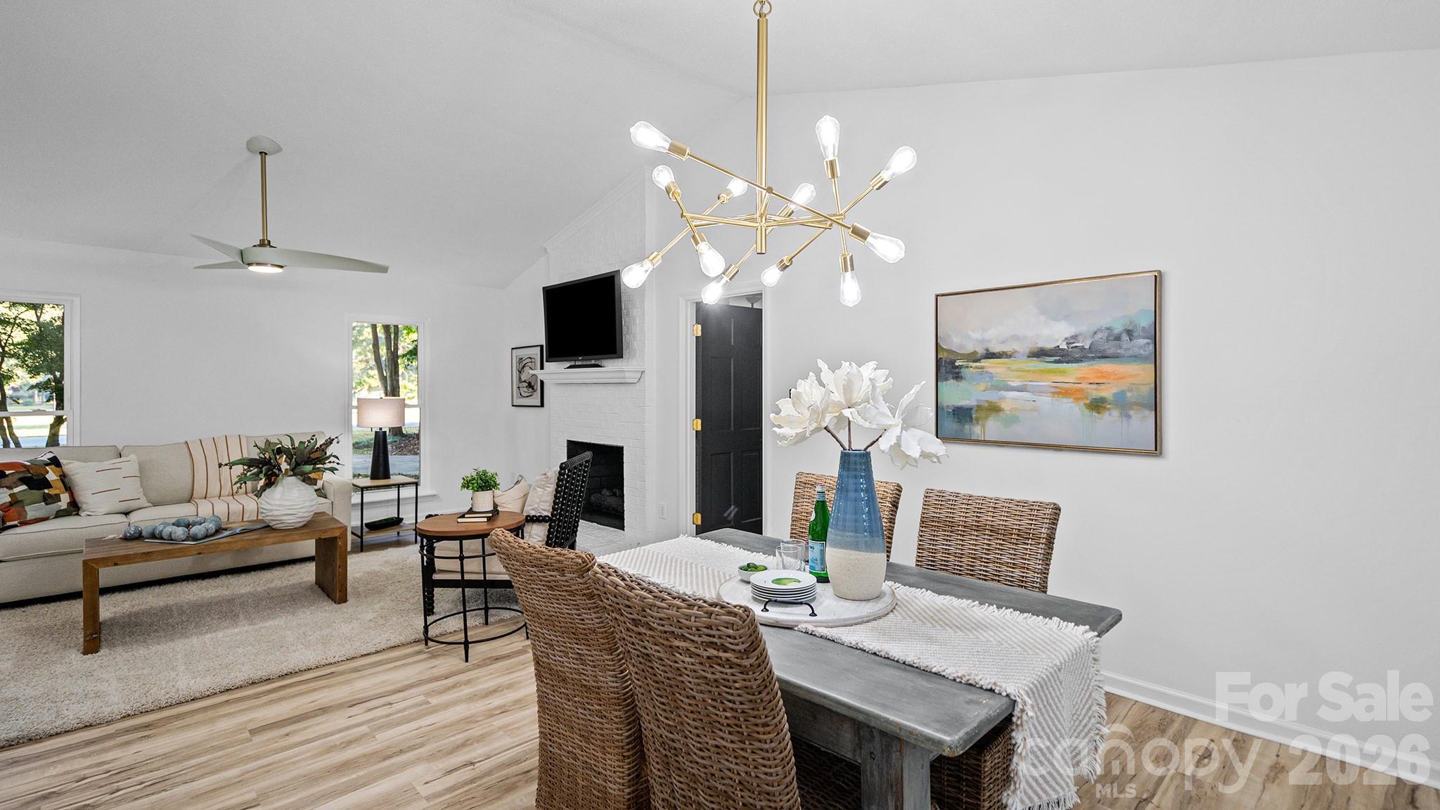 New Dining Room Chandelier and Ceiling Fan in the Living Room - 8001 Saddlehorse Lane, Charlotte