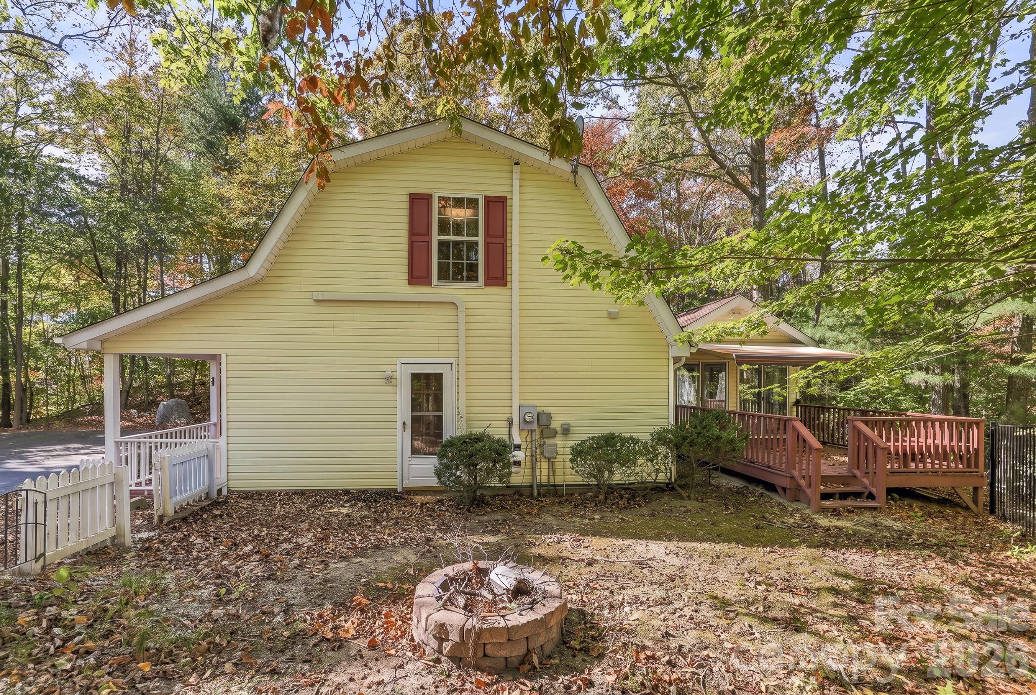 fenced back yard with firepit - 114 Sandpiper Palisades Street, Hendersonville