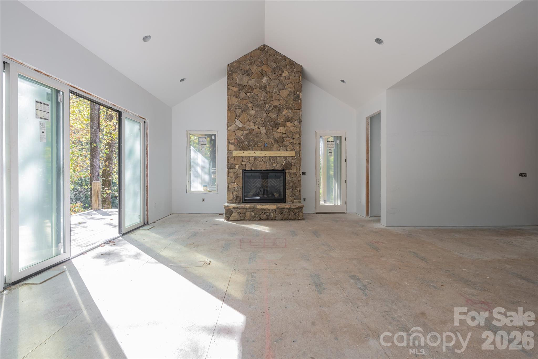 Living room highlighted by vaulted ceiling and gas fireplace - 200 Bent Pine Trace, Hendersonville