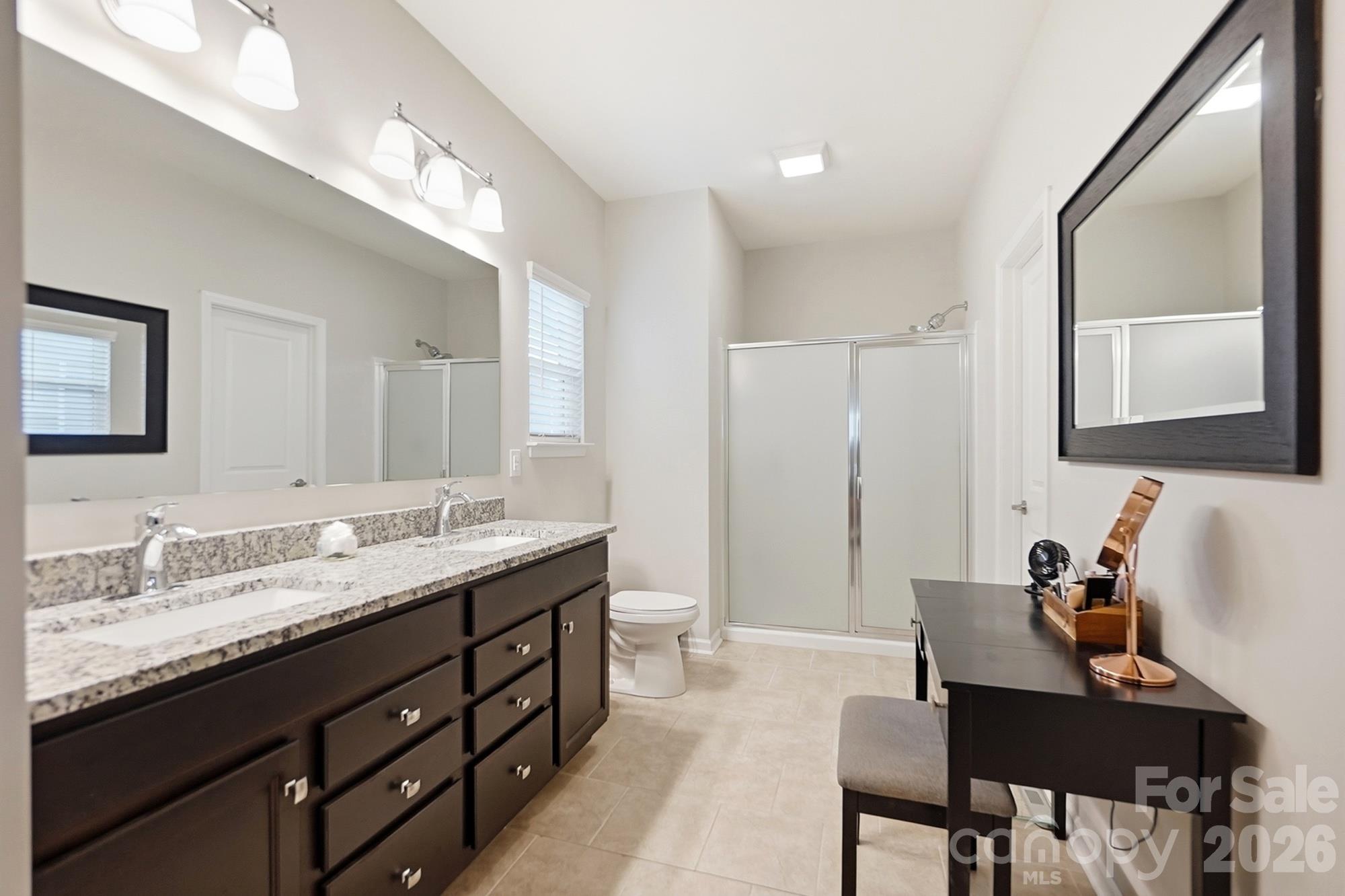 expansive primary bath with 2 walk in closets - 4509 Bent Green Lane, Monroe
