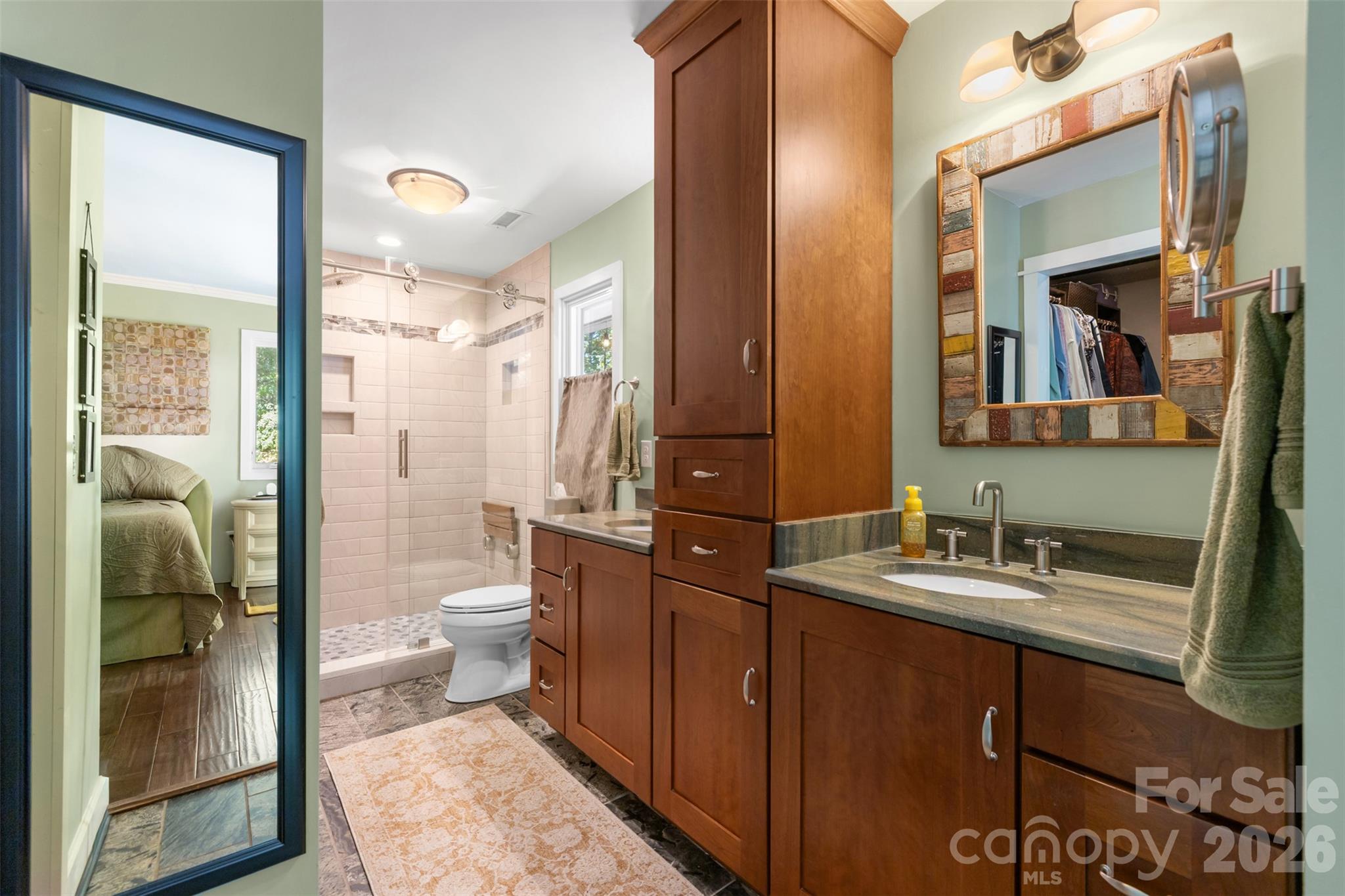 Primary bath with step in shower, dual vanity, linen tower and walk in closet - 4 Thornwood Lane, Lake Wylie