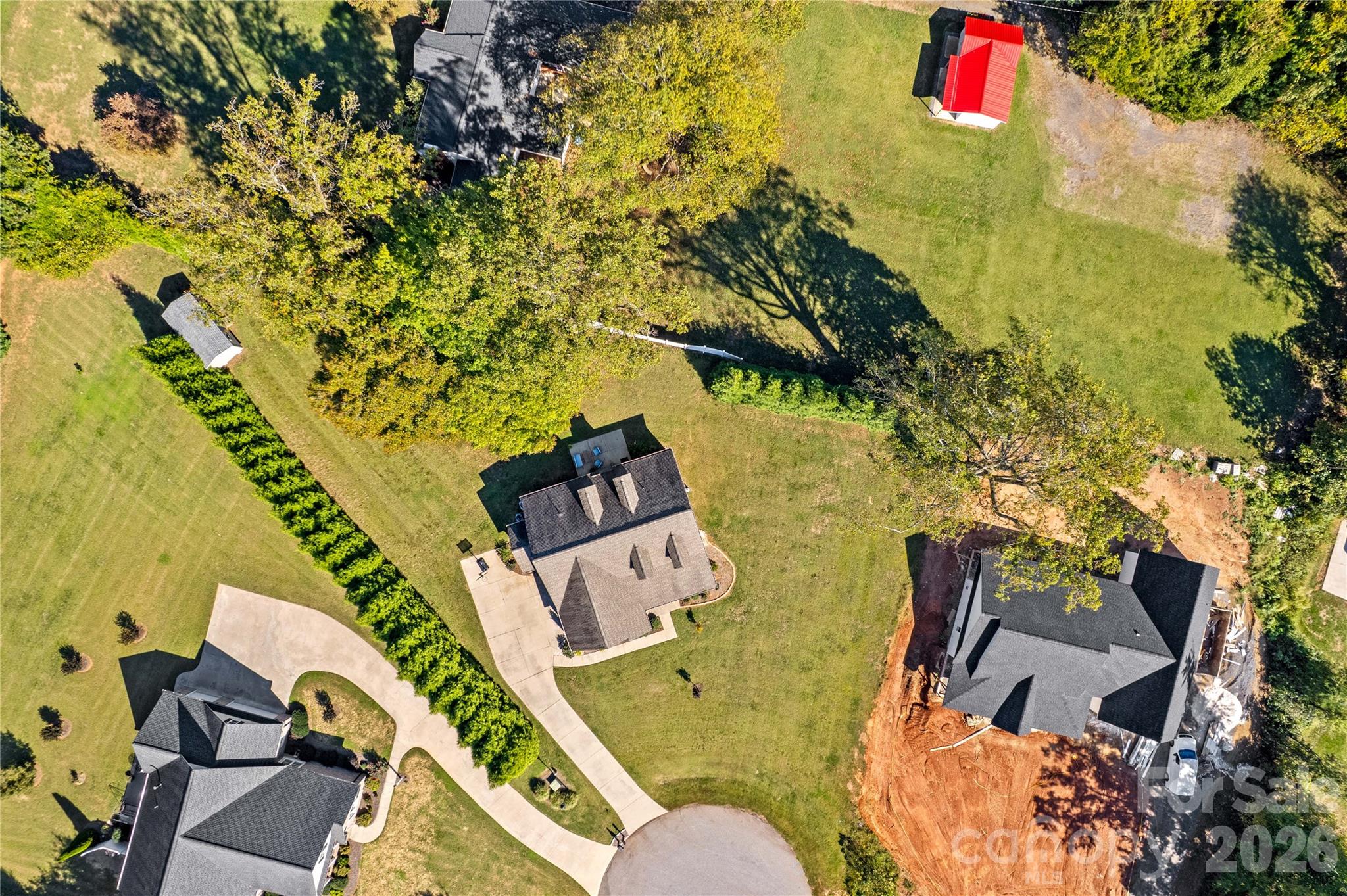 Aerial view shows Large yard with year round privacy provided by evergreens - 178 Nellwood Court, Mocksville