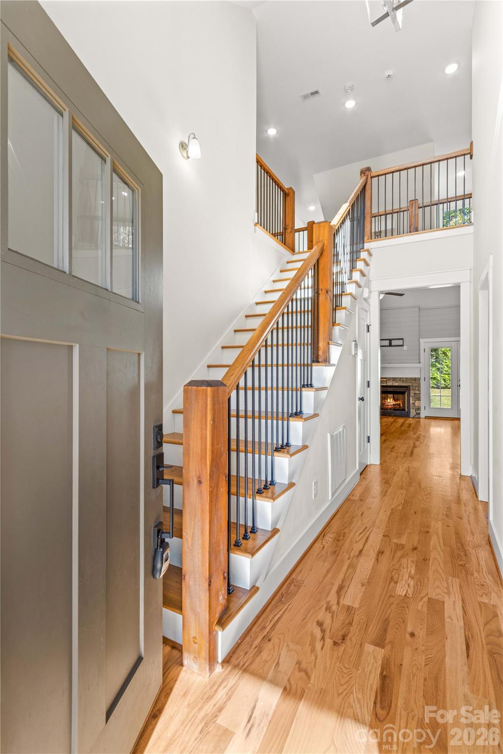 Welcoming foyer with beautiful hardwood staircase with metal spindles. - 178 Nellwood Court, Mocksville