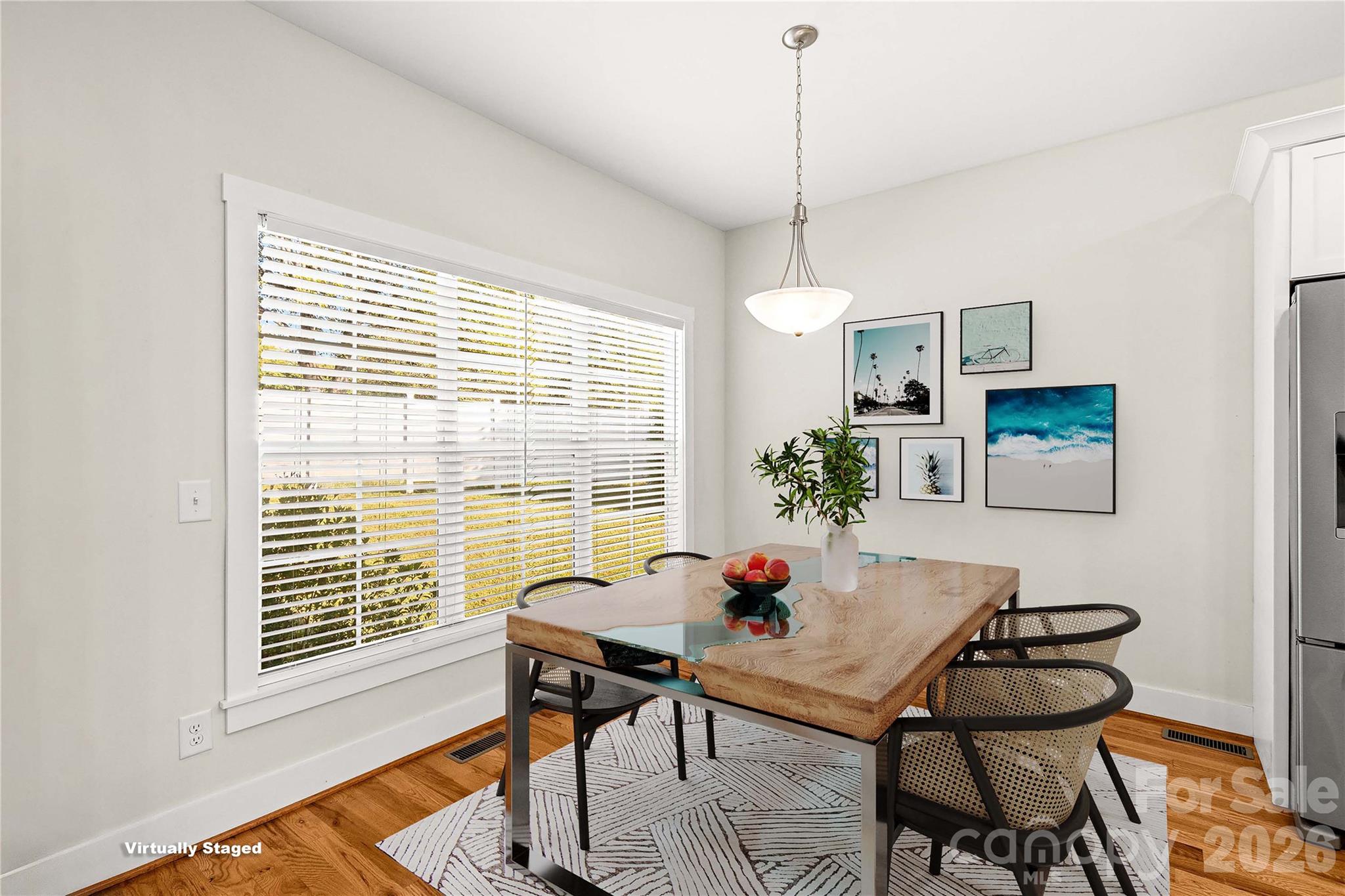 Breakfast area looks out on natural area in the back. Large windows. - 178 Nellwood Court, Mocksville