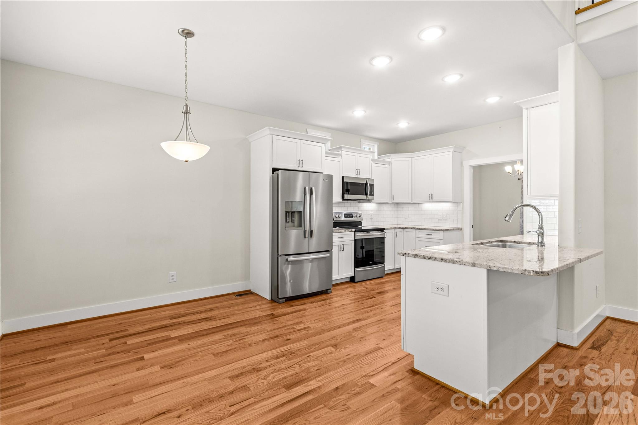 Kitchen is light and spacious! Breakfast area on the left - 178 Nellwood Court, Mocksville