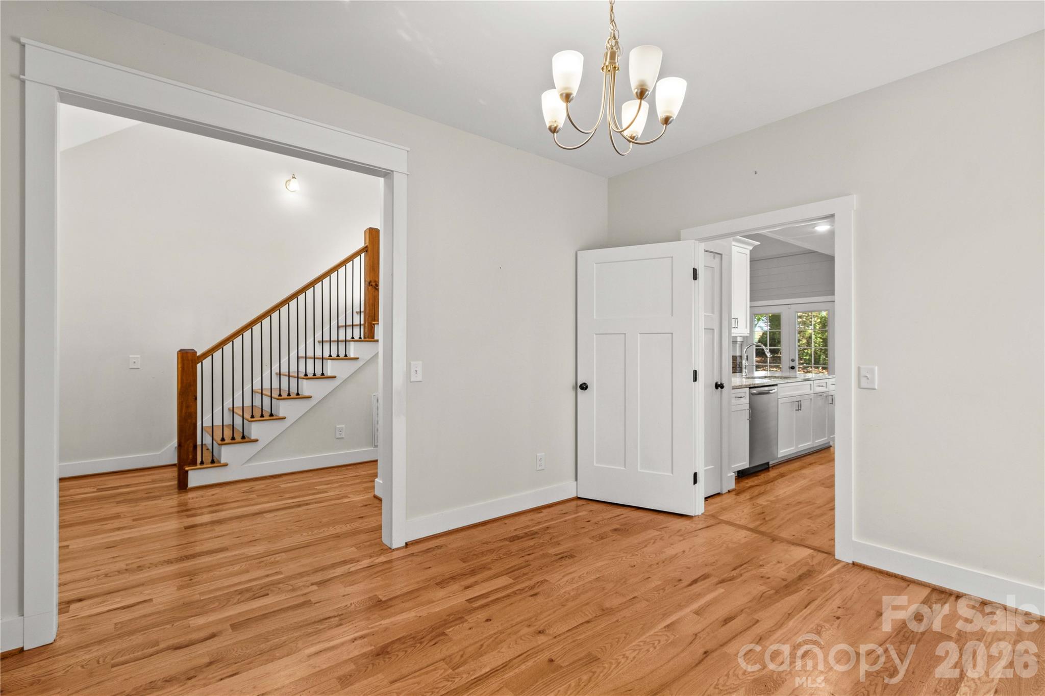 Dining room off the entry hallway. Looking toward kitchen on the right. - 178 Nellwood Court, Mocksville