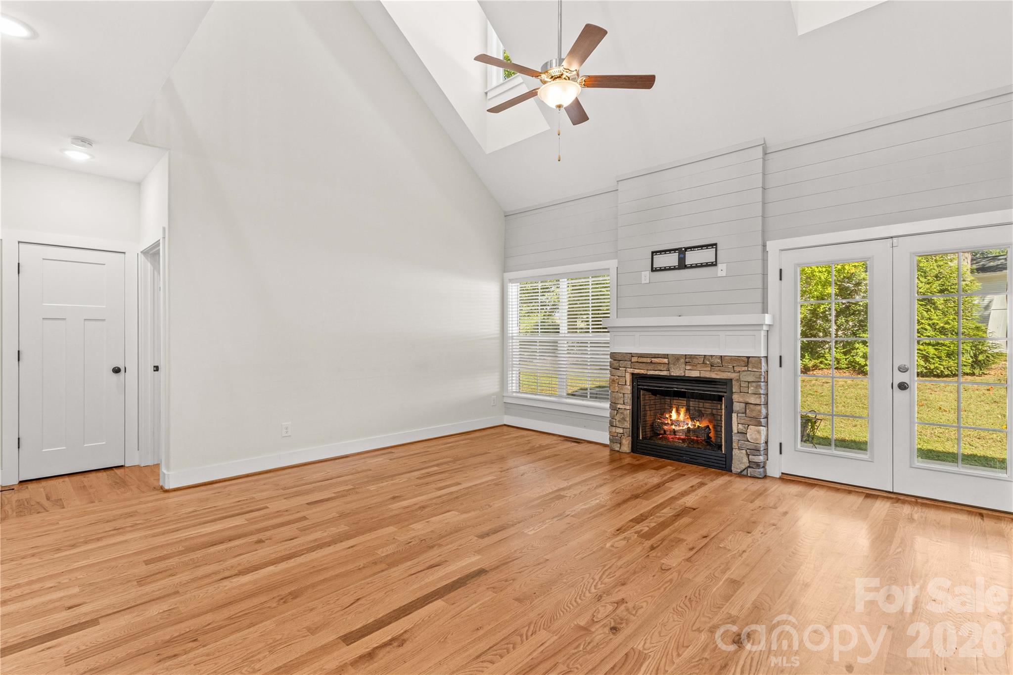 Great room with stone fireplace and hardwood floors - 178 Nellwood Court, Mocksville