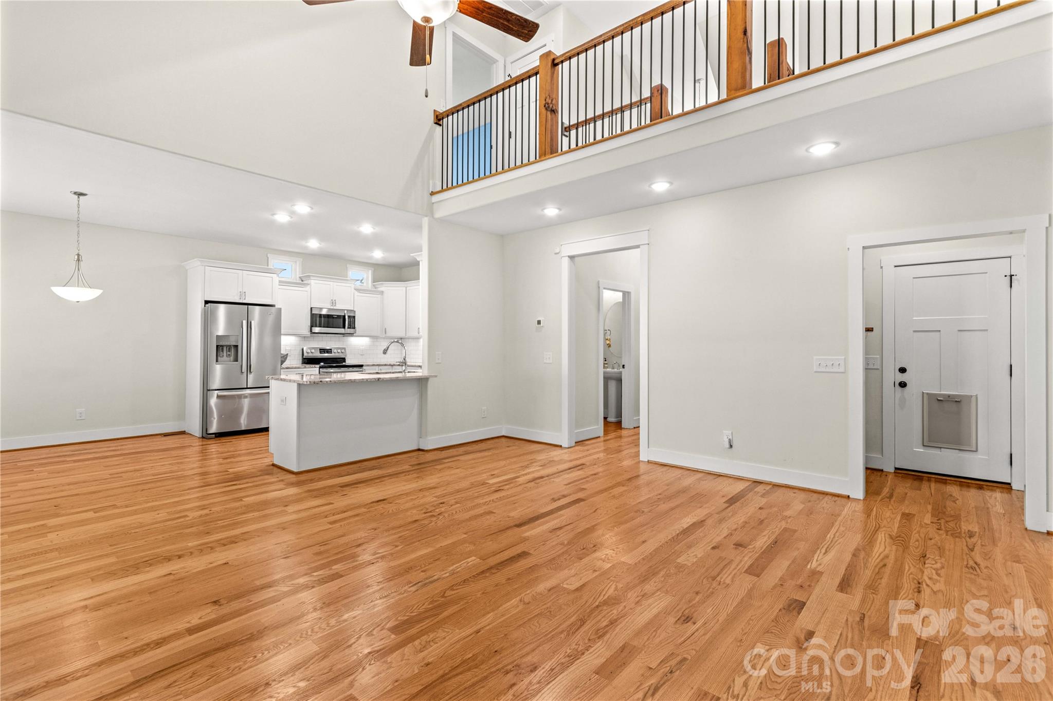 So pretty! Living room looking toward kitchen. - 178 Nellwood Court, Mocksville