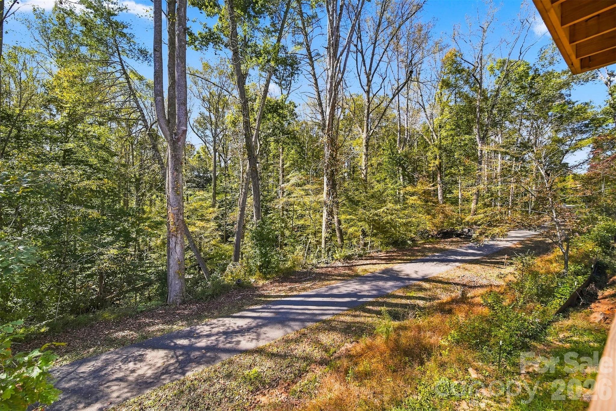 With...a walking trail behind the house! Are you ready to enjoy a nice walk or bike ride? - 414 Scarlett Oak Court NE, Lenoir