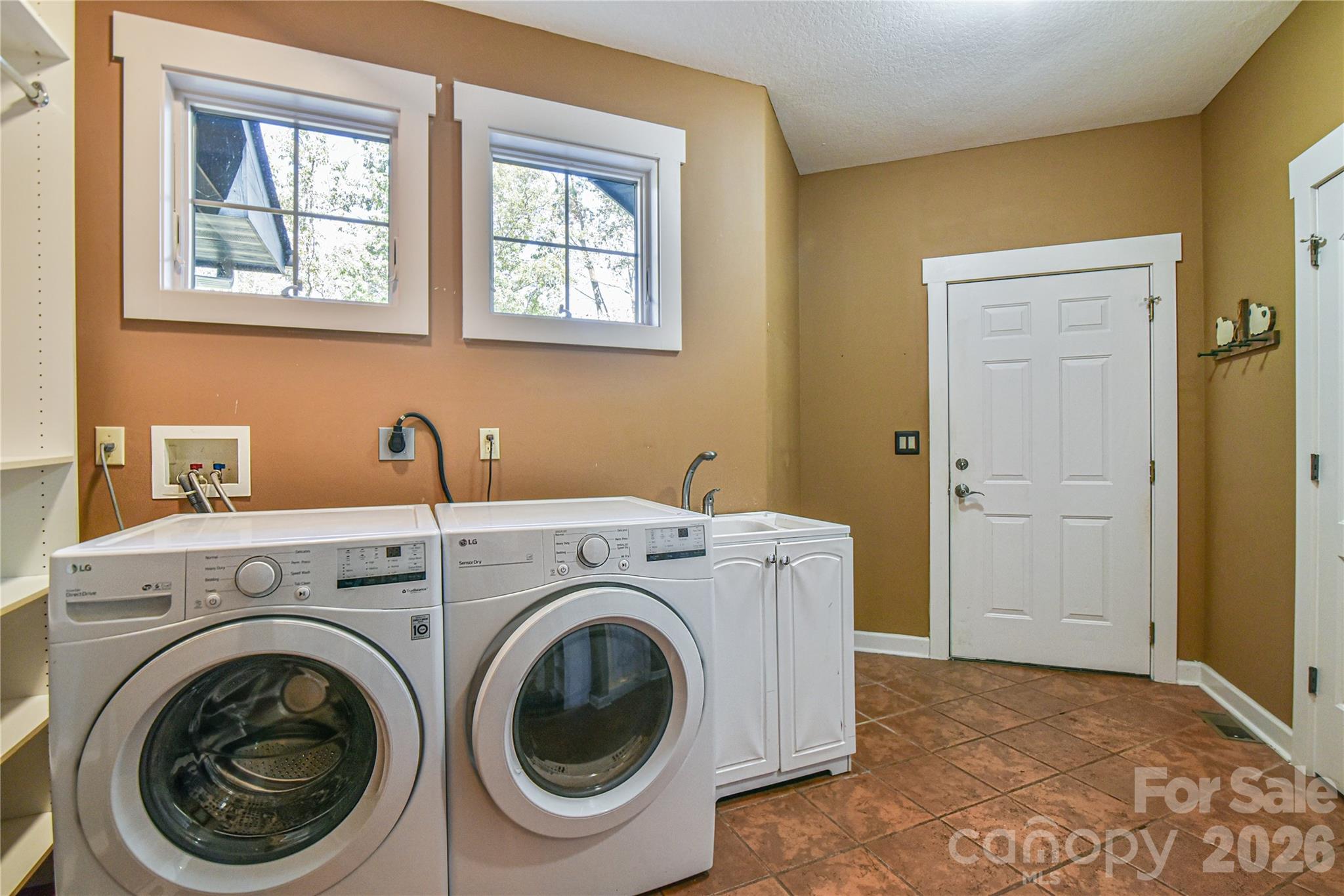 A handy combination laundry and mud room off the garage. - 39 Oak Hollow Drive, Asheville