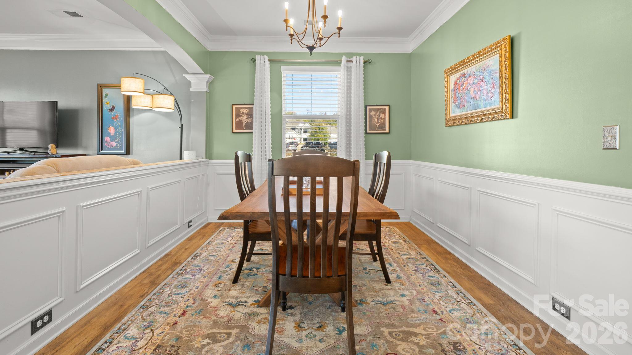 Elegant dining/flex room with wainscotting and crown moulding - 1232 New River Drive, Concord