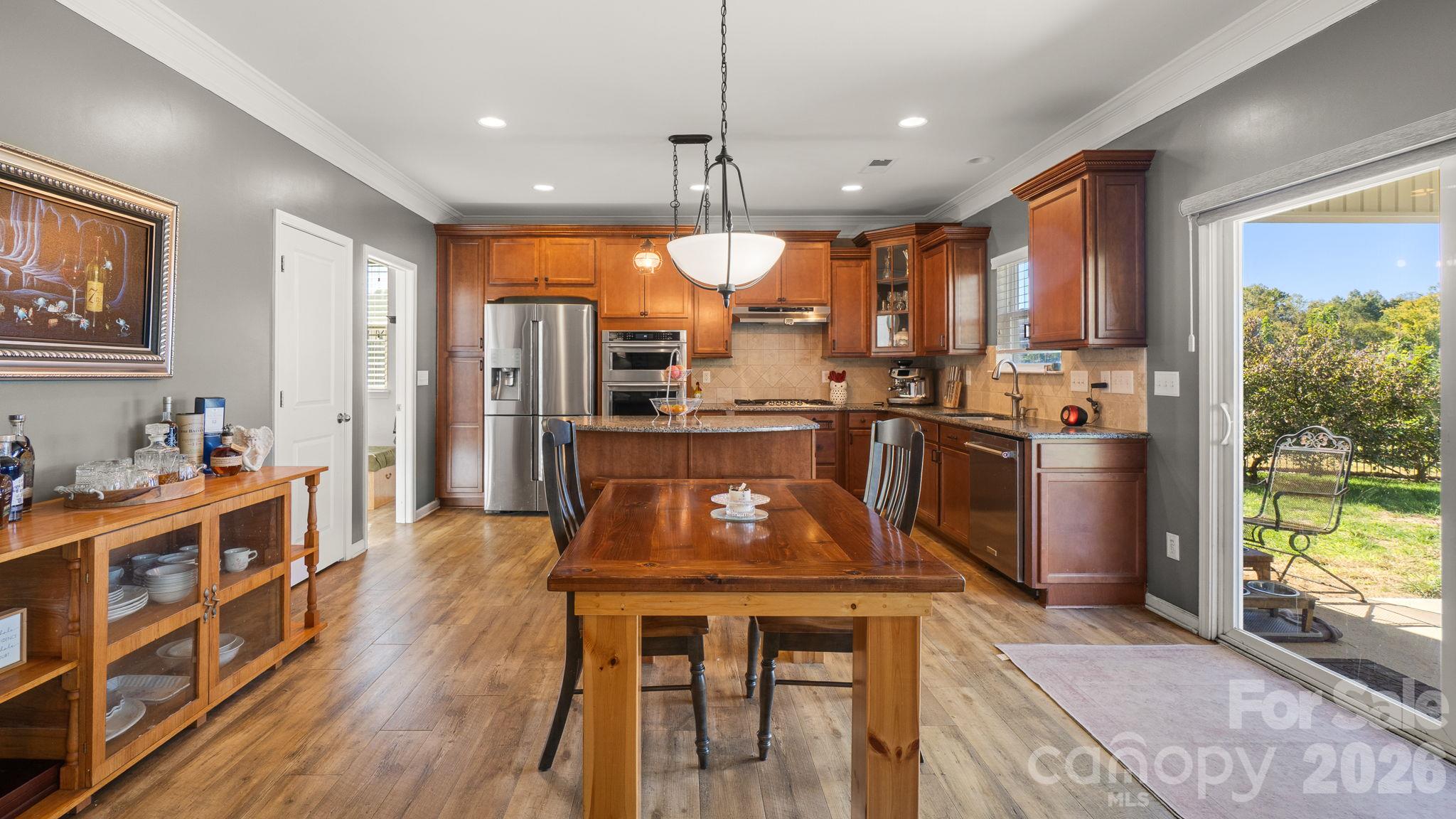 Spacious kitchen with walk-in pantry, stylish lighting - 1232 New River Drive, Concord