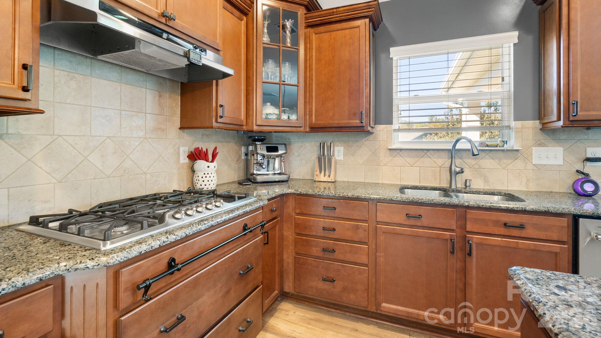 Upgraded gas cooktop, pull-out cabinetry shelving - 1232 New River Drive, Concord
