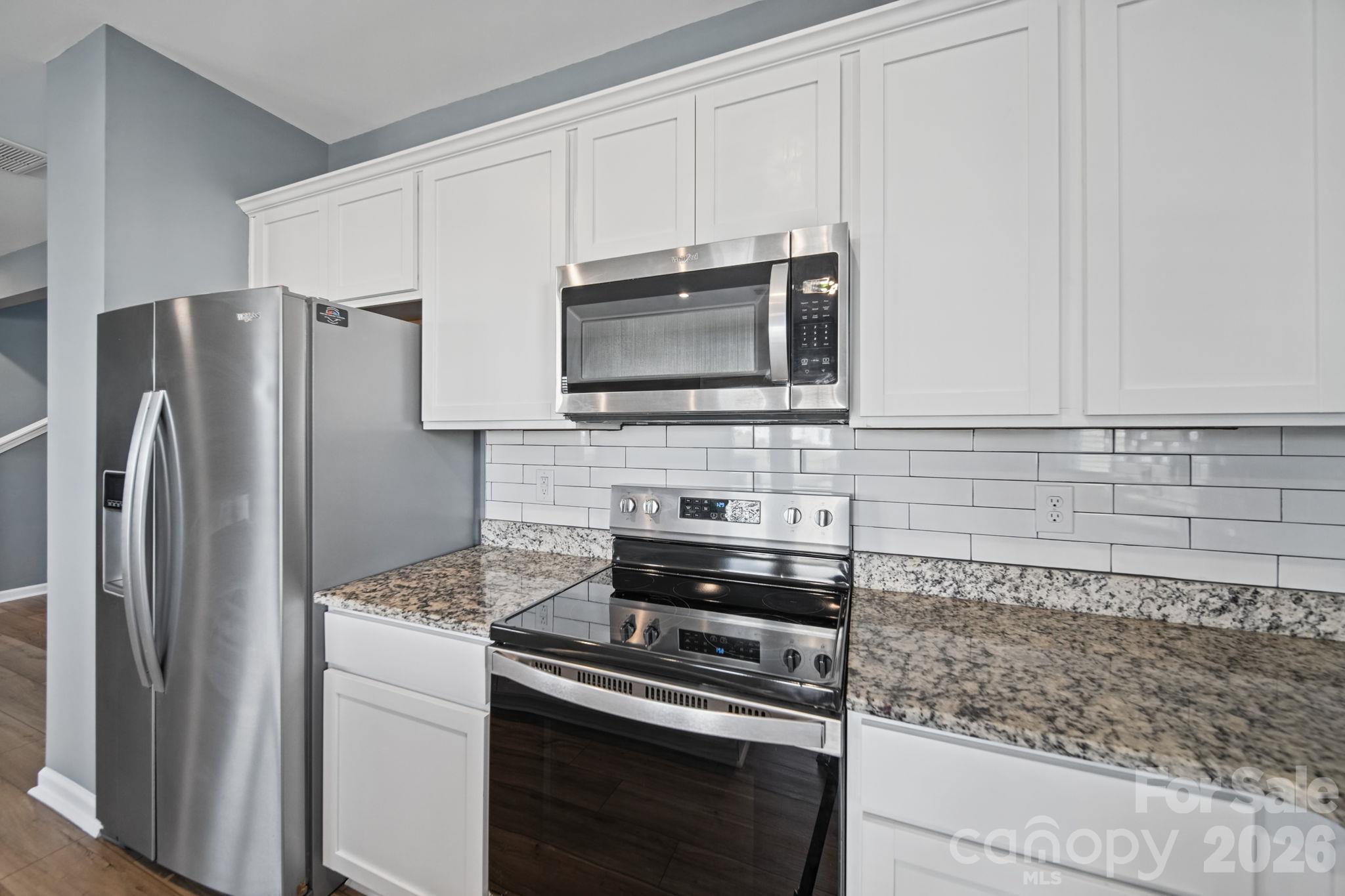 Kitchen, with New Pristine Subway Tile Backsplash. - 3082 Bell Spur Avenue SW, Concord