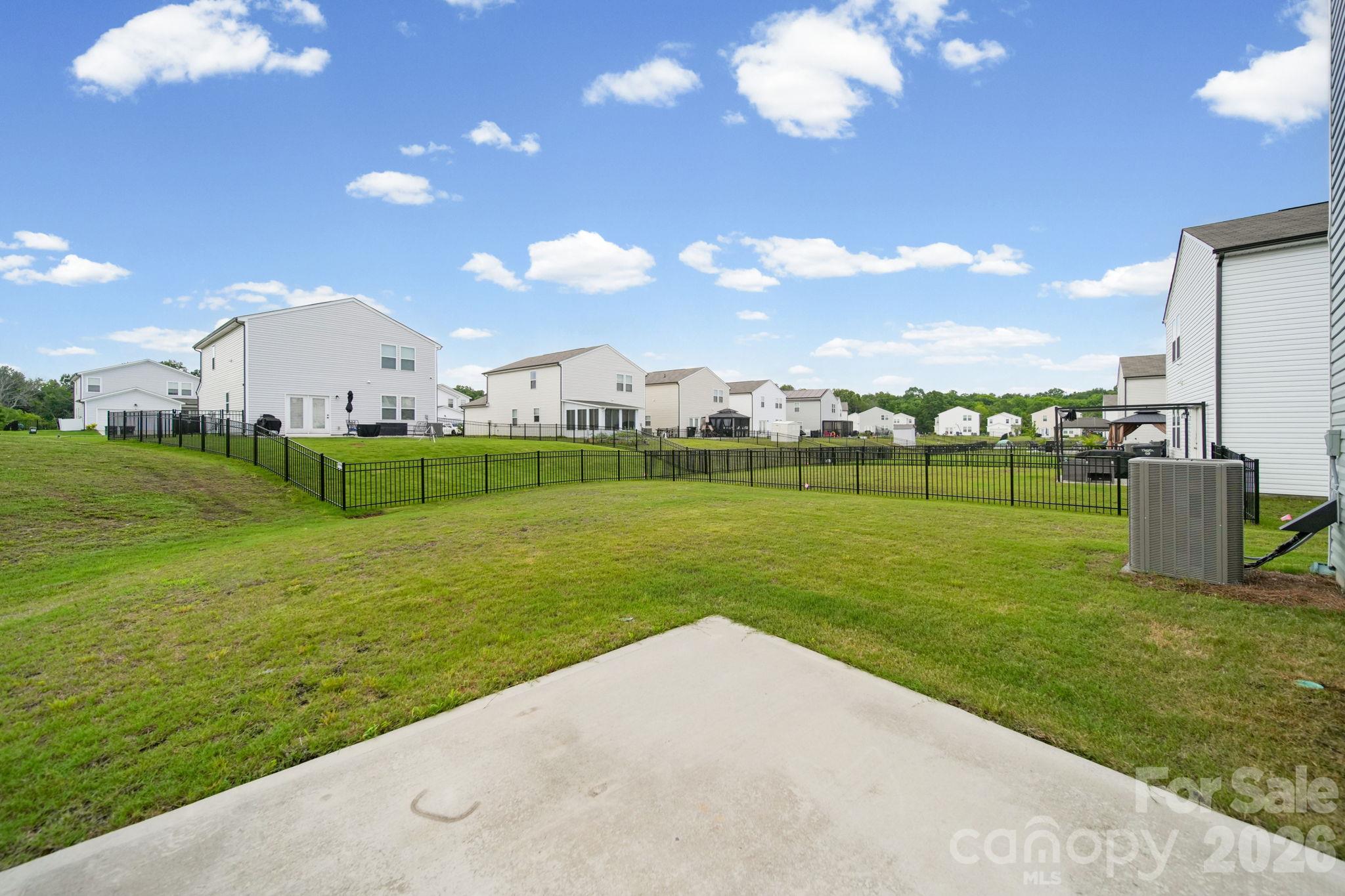 Exterior view of the large backyard. - 3082 Bell Spur Avenue SW, Concord