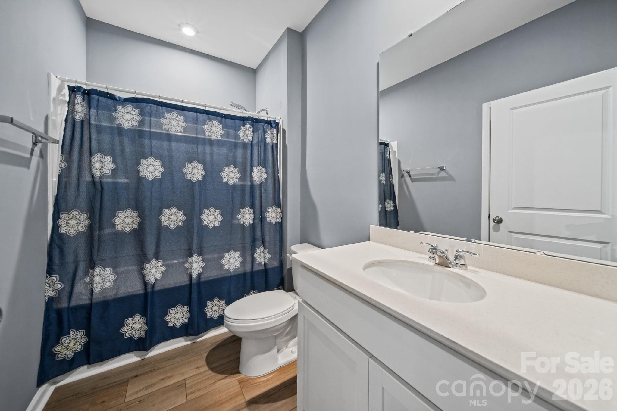 Downstairs Full Bath, with fresh paint and Luxury Vinyl Plank Floors. - 3082 Bell Spur Avenue SW, Concord