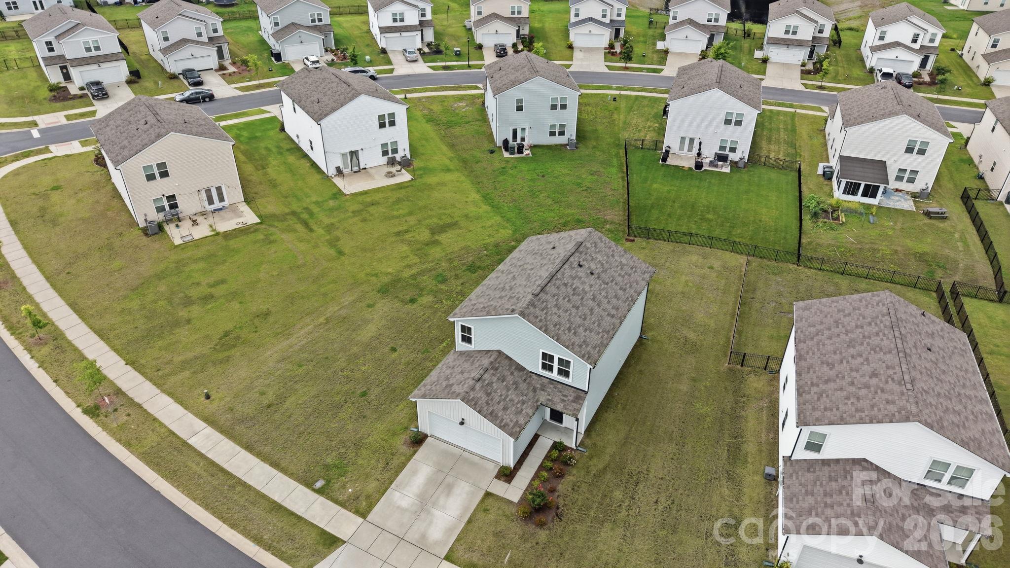 A bird's eye view, giving attention to the large lot that the property sits on. - 3082 Bell Spur Avenue SW, Concord