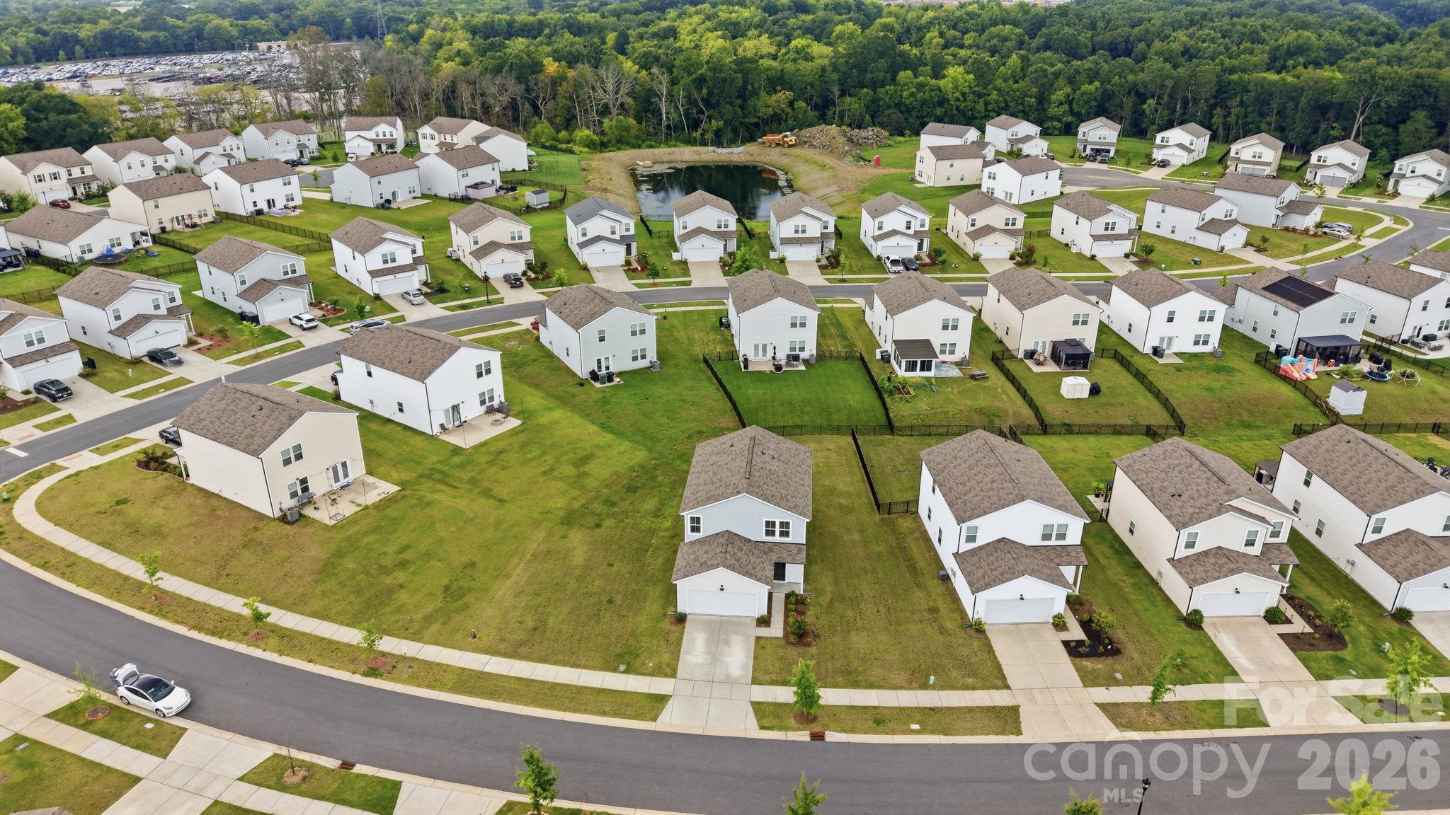 A bird's eye view, giving attention to the large lot that the property sits on. - 3082 Bell Spur Avenue SW, Concord