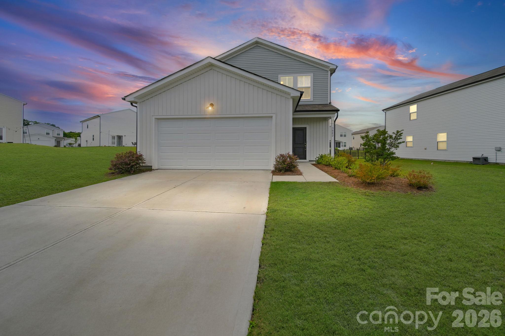 A bird's eye view, giving attention to the large lot that the property sits on, [Twilight Shot] - 3082 Bell Spur Avenue SW, Concord