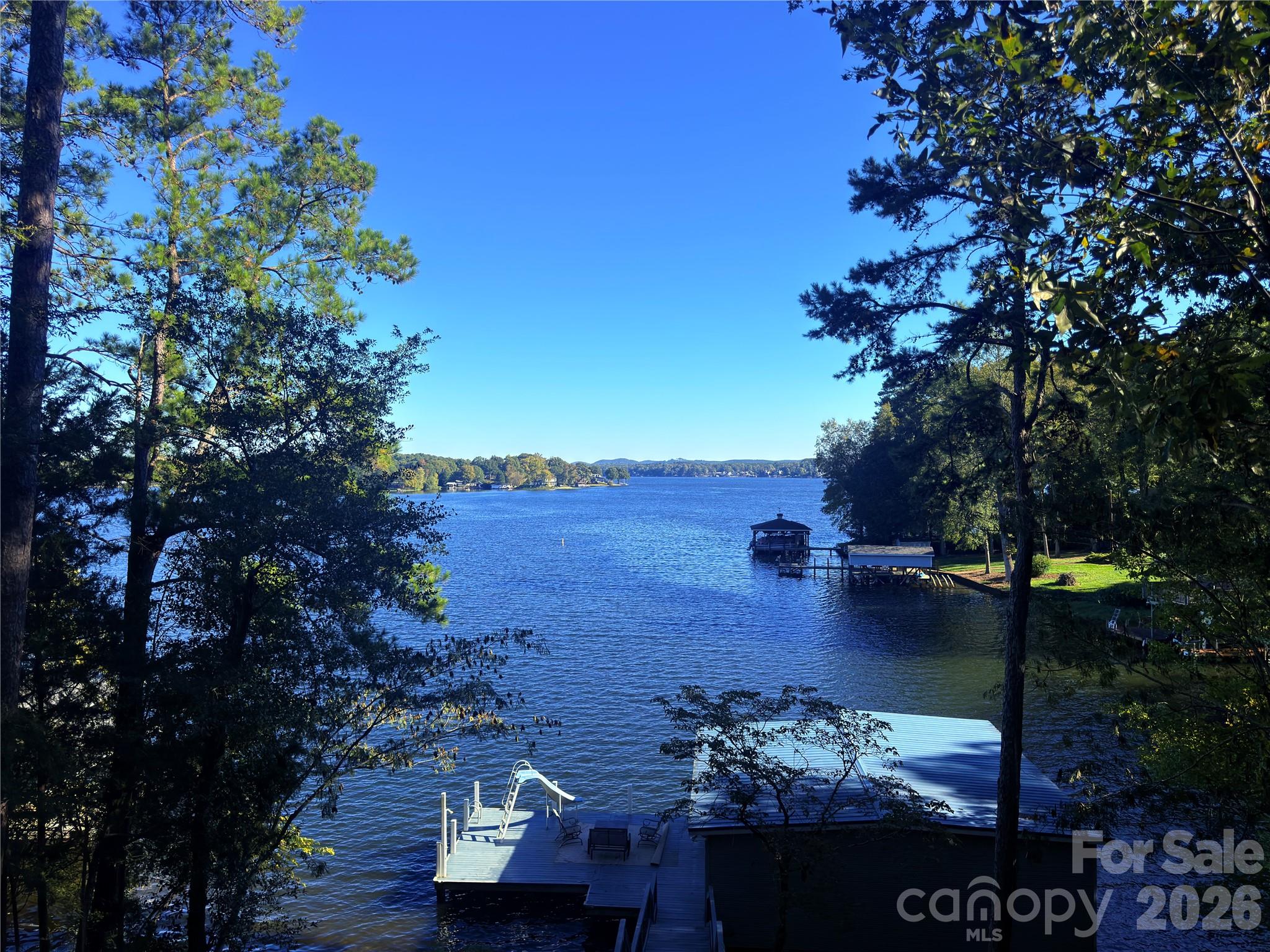 View of boat house and dock and the Uwharrie Mountains. - 547 Lake Shore Drive, Norwood