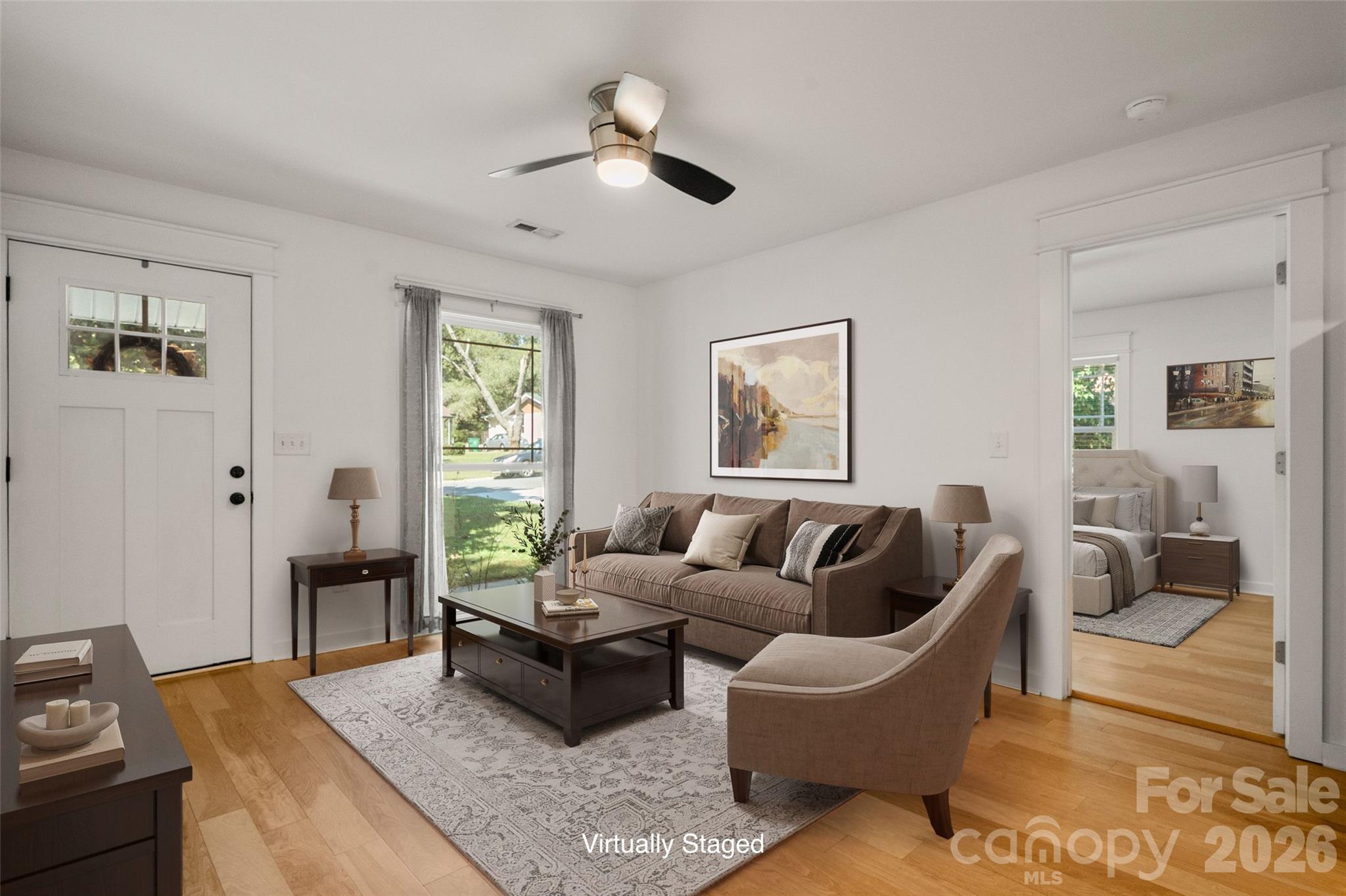Large floor to ceiling window in Living Room brings in so much light! - 4238 Dowling Drive, Charlotte