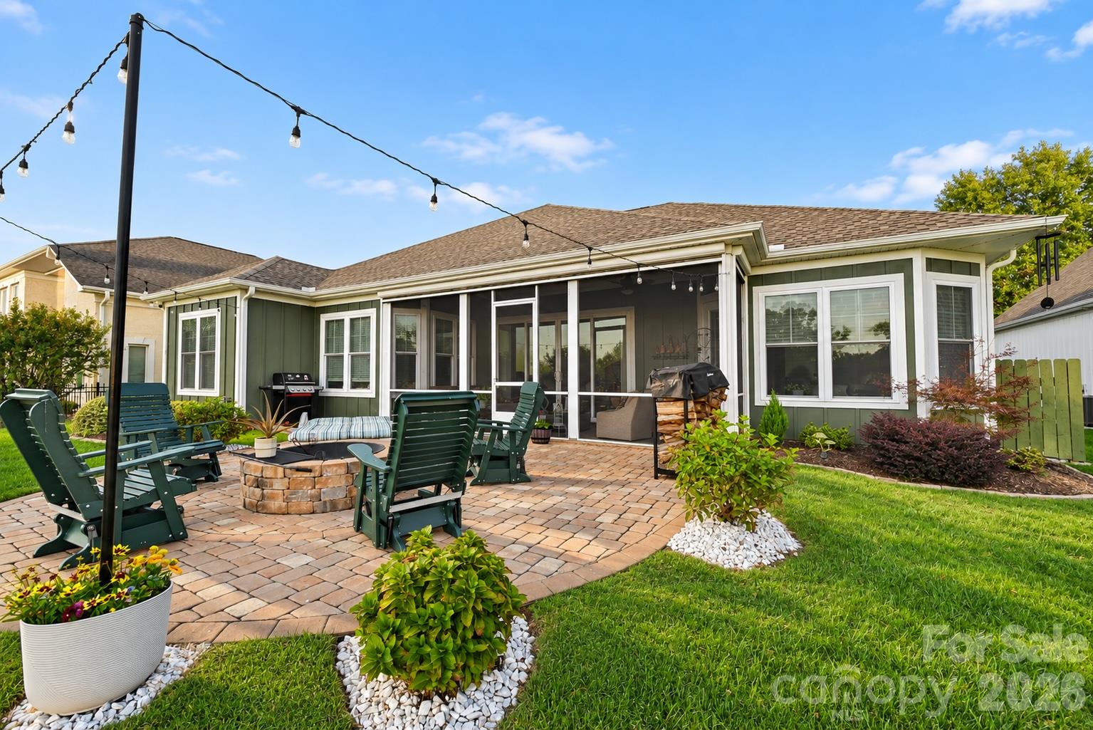 Back of home overlooking golf course with a beautiful 441 sq ft patio with firepit to enjoy sunsets. - 3668 Rock Bridge Drive NE, Conover