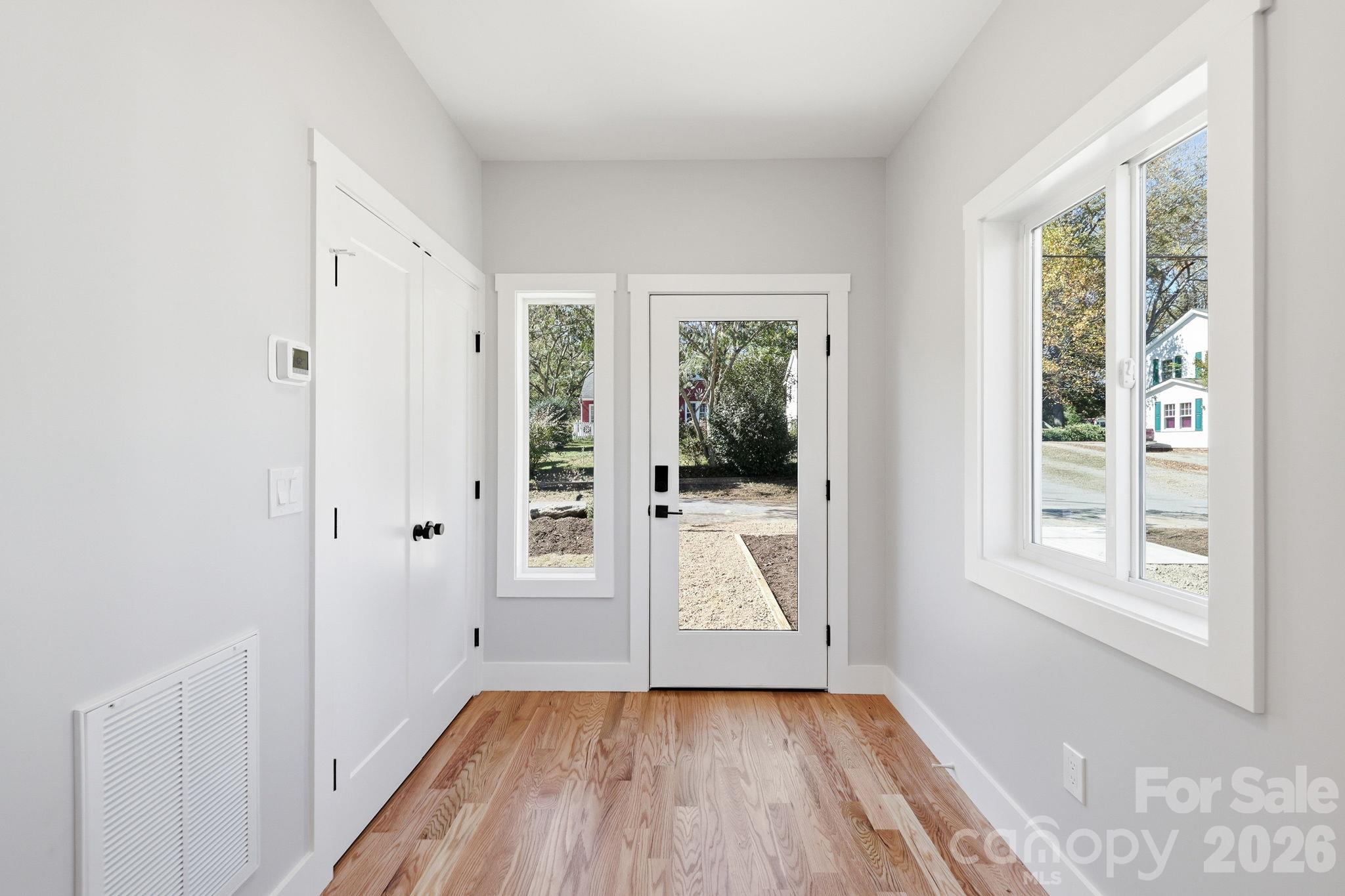 A bright and light-filled entry way with hallway closet making entering and leaving enjoyable - 20 Laurel Loop, Asheville