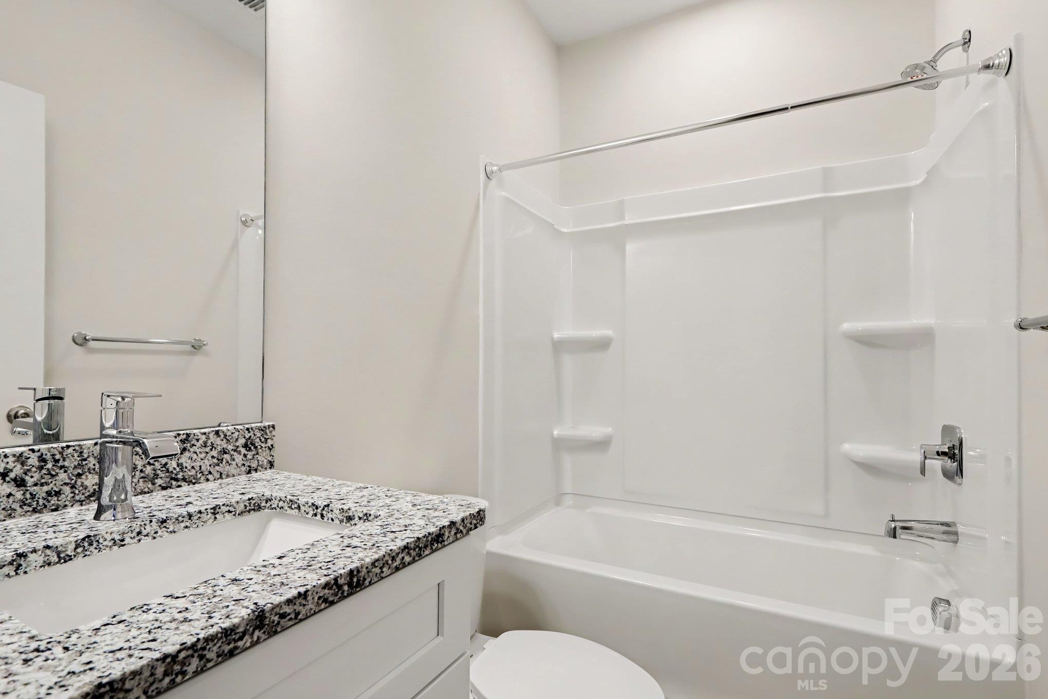 Hallway bathroom actual non-staged photo. Features granite single vanity countertop and shower/tub combo. - 125 Buffalo Avenue NW, Concord