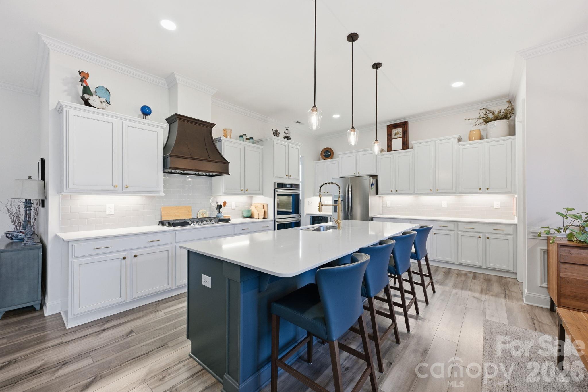 Welcome to the ease of entertaining featuring a custom vent hood and drawer microwave - 4025 Pollock View, Mount Holly