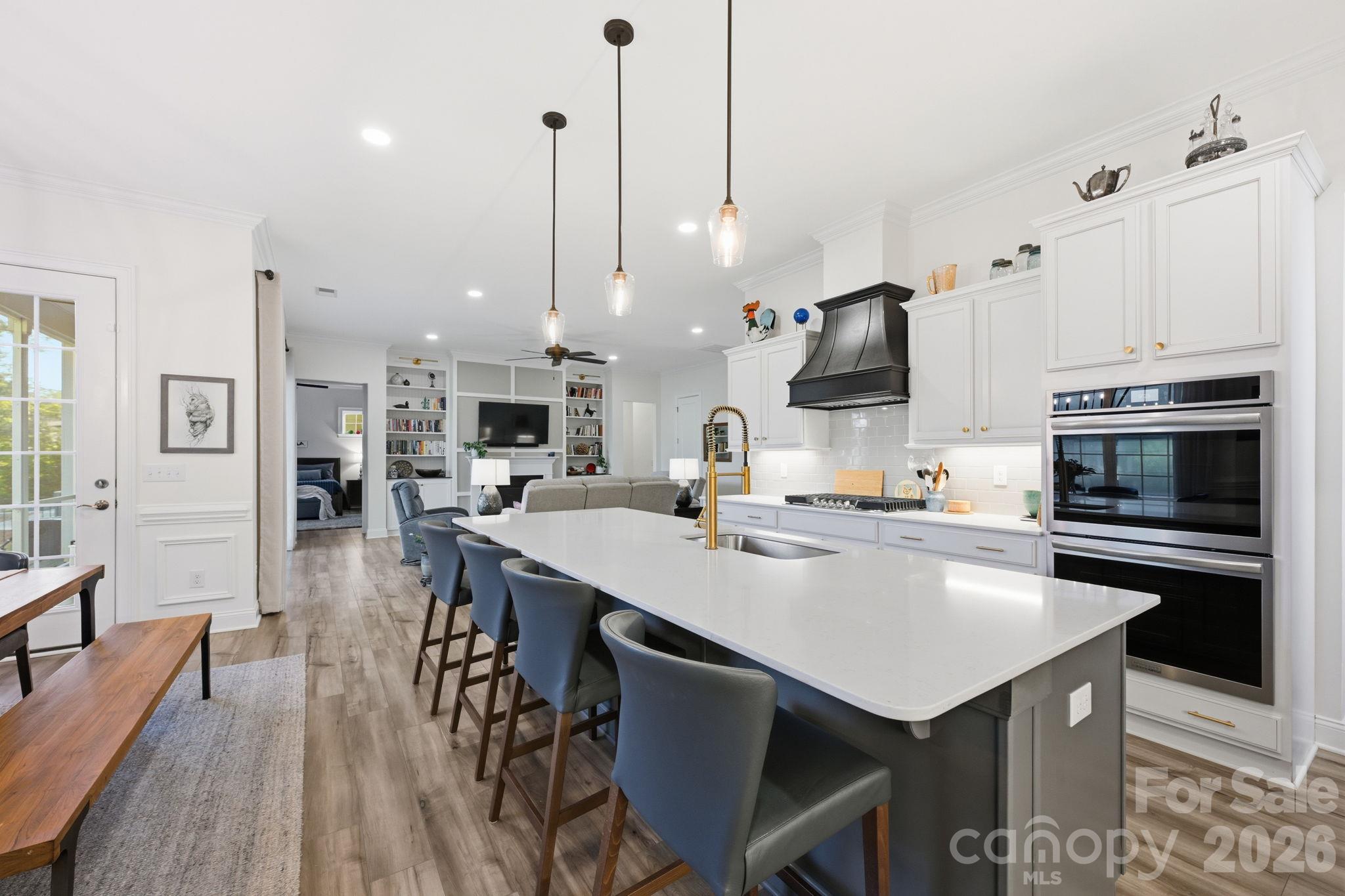The quartz island offers space for prepping meals and entertaining - 4025 Pollock View, Mount Holly