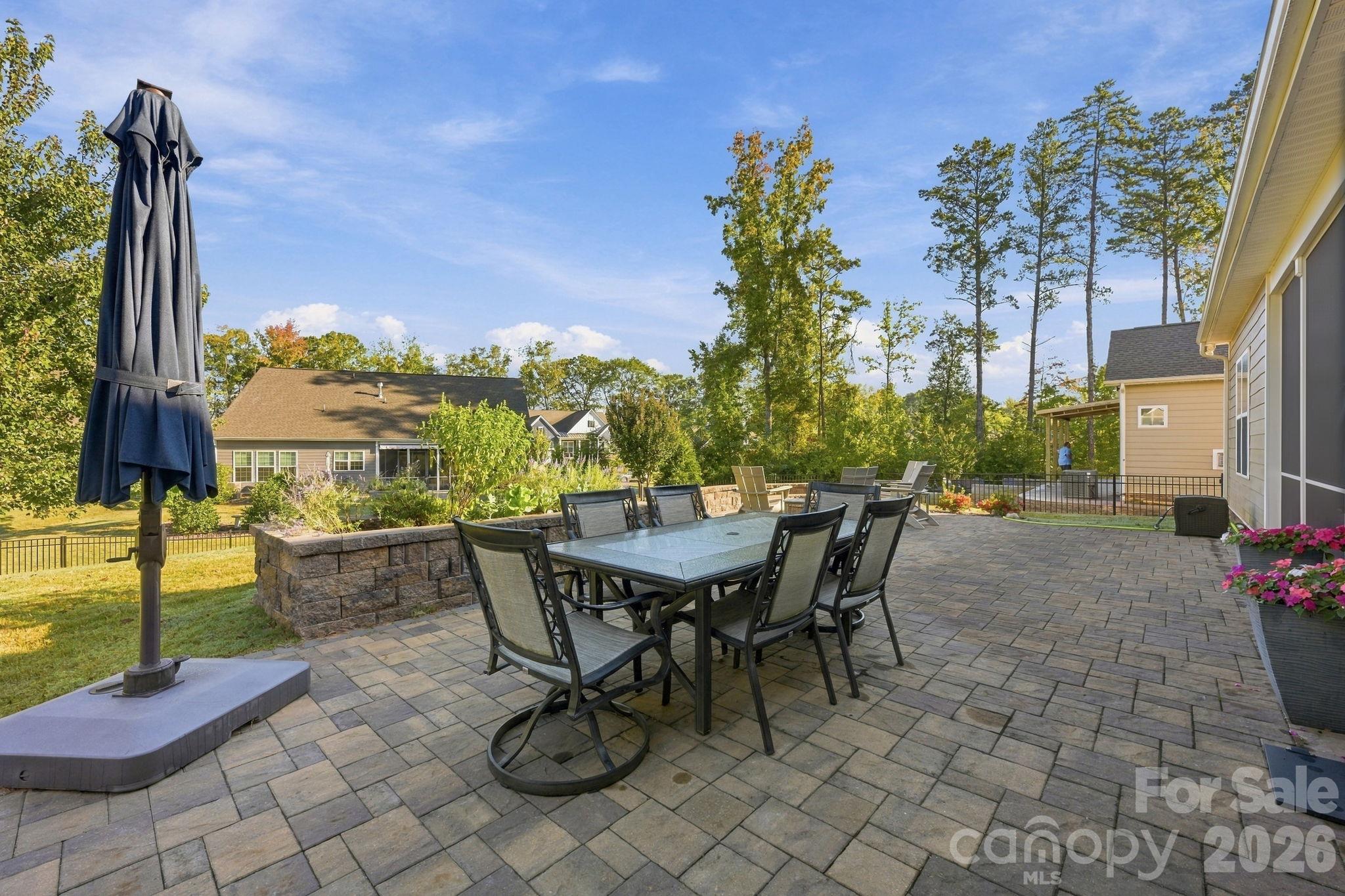 Expansive paver patio extends to the fire pit and front of house - 4025 Pollock View, Mount Holly