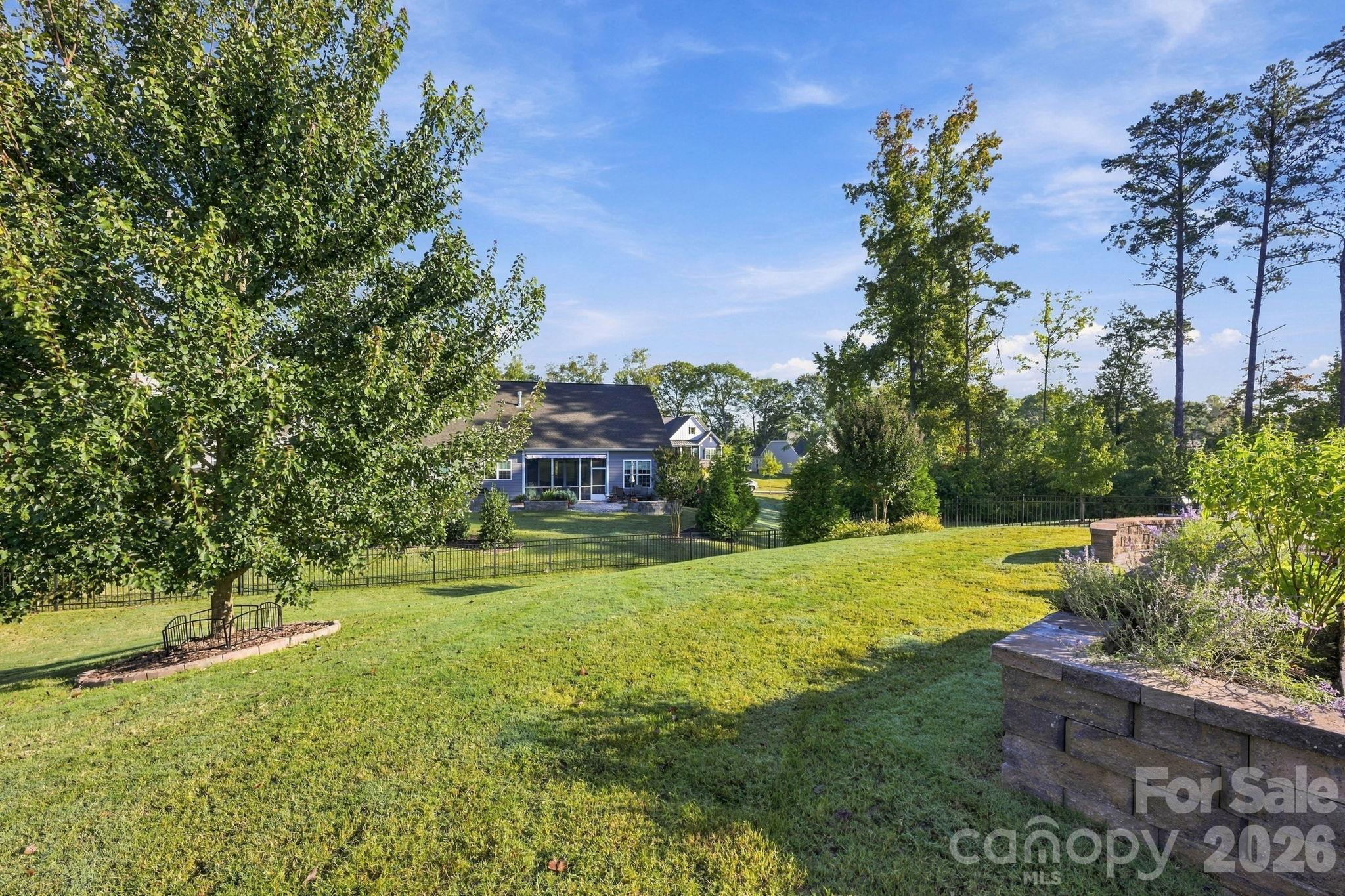 Professionally landscaped fenced yard - 4025 Pollock View, Mount Holly