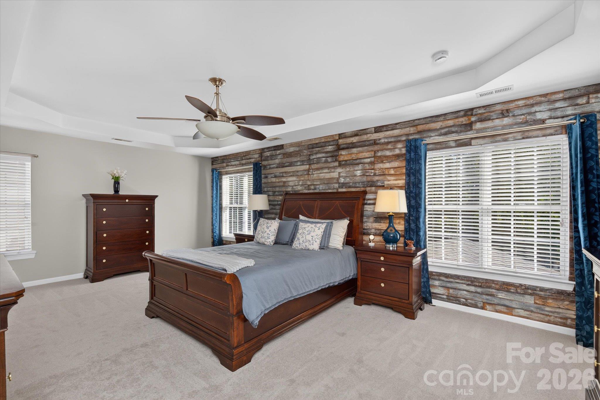 Spacious primary bedroom with accent wall - 6107 Cactus Valley Road, Charlotte