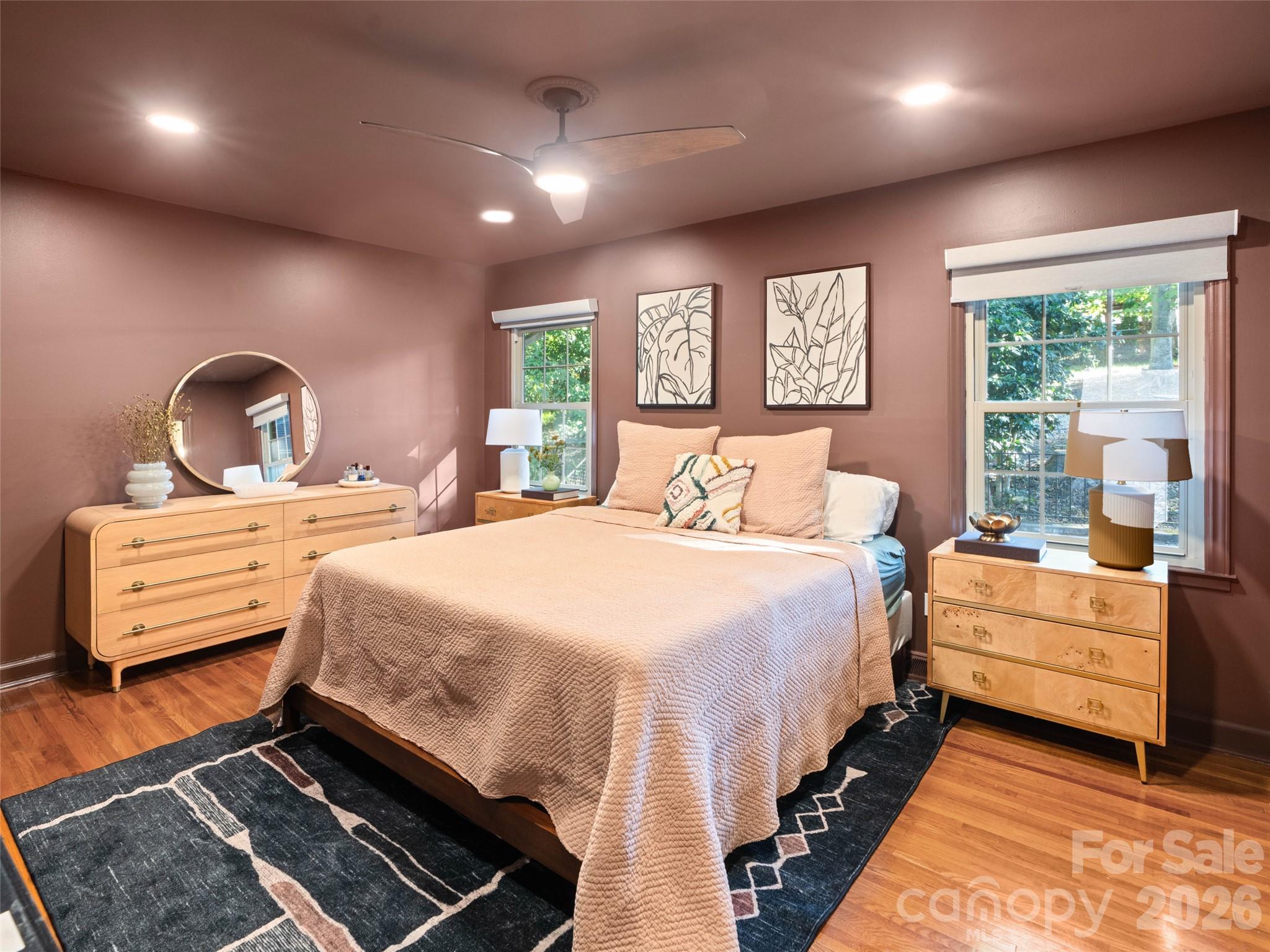 The primary suite blends modern charm with a fresh, updated feel, featuring fresh paint from ceiling to floor and the convenience of dual closets. Privately situated at the rear of the main level, this inviting retreat offers a peaceful escape from the main living areas. - 6626 Rocky Falls Road, Charlotte