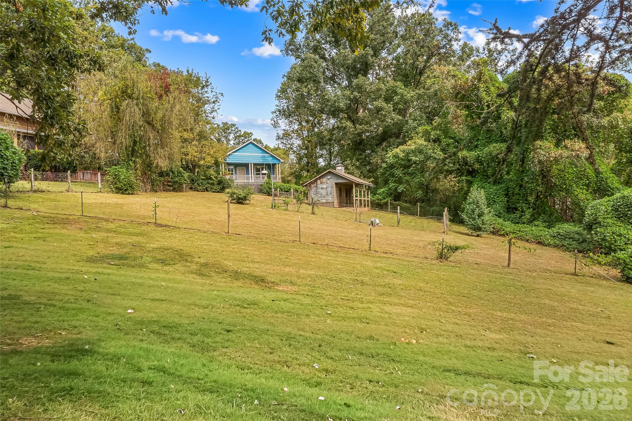 View of pasture and stable with 68 Oteen Church Rd (Blue Cottage) in the background (standing behind 72 Oteen Church Rd) - 68, 72, 82, and 84 Oteen Church Road, Asheville