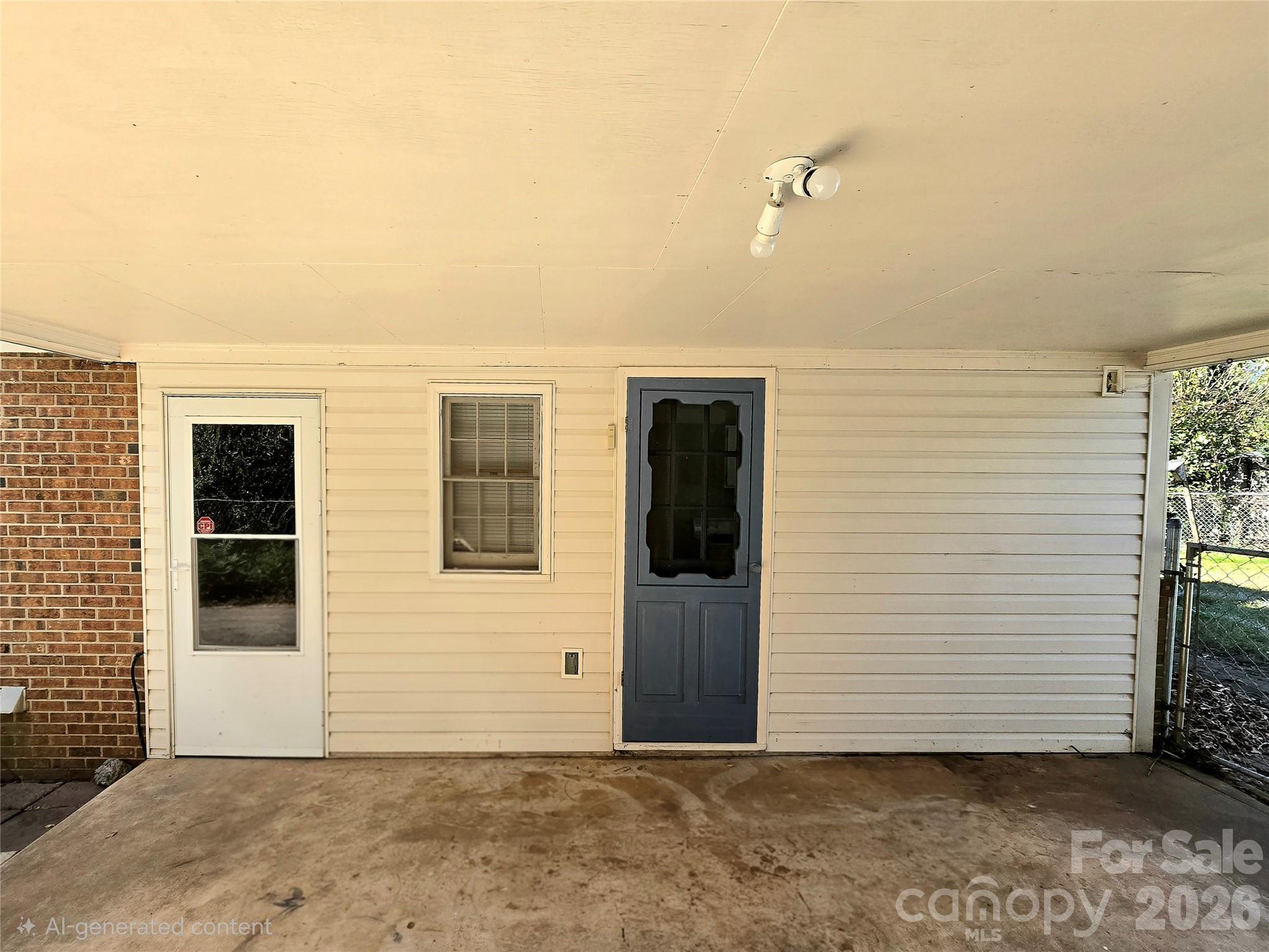 Exterior entrances from carport #2. One into the walk through area and the other into the laundry room. - 112 Wendover Drive, Lincolnton